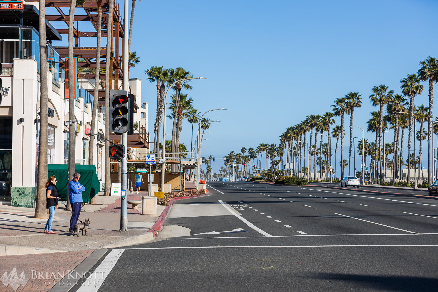 PCH and Main Street in Huntington Beach. What would normally be congested with cars and people are now nearly empty.