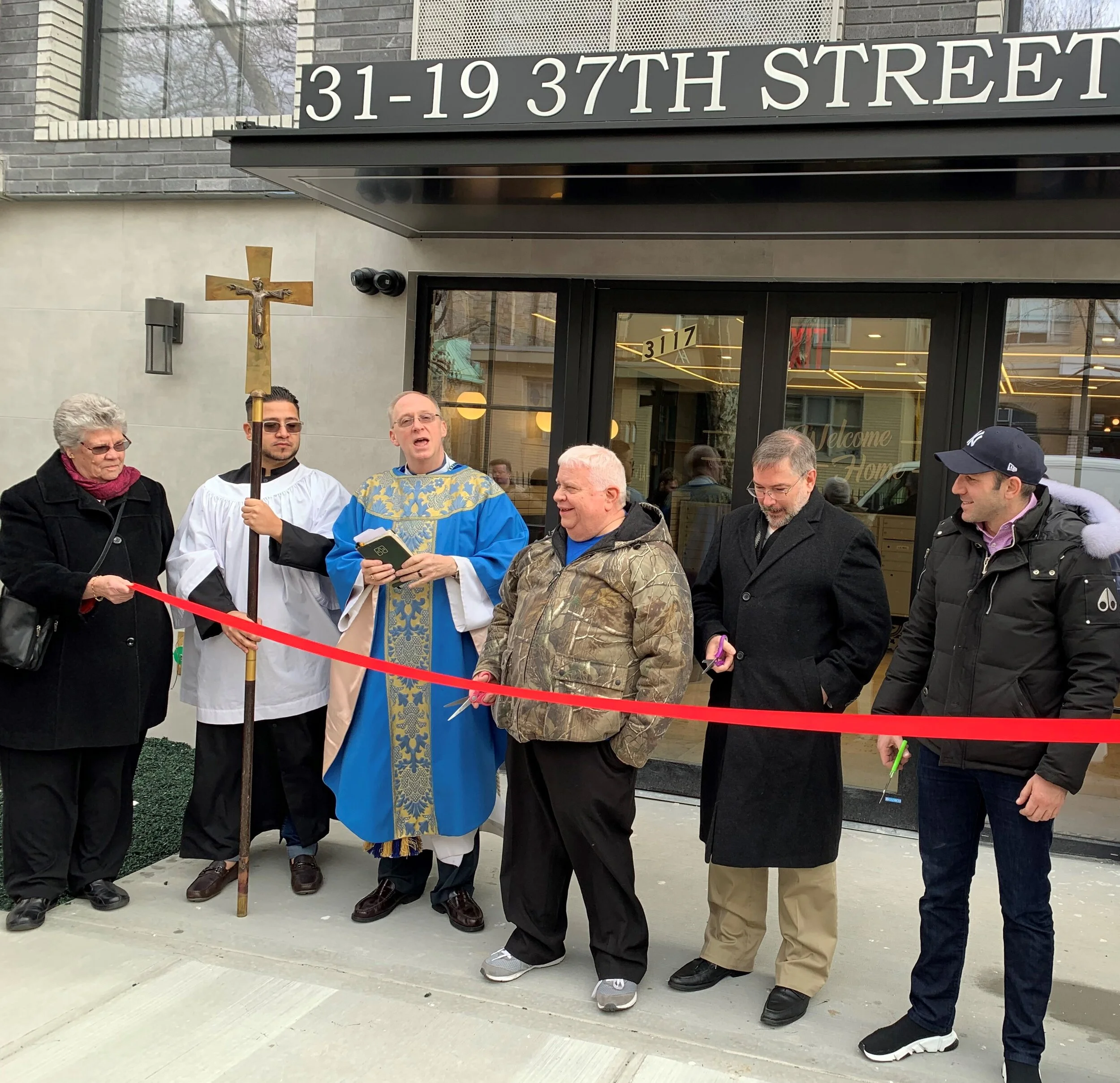 New apartment building dedicated on former parking lot