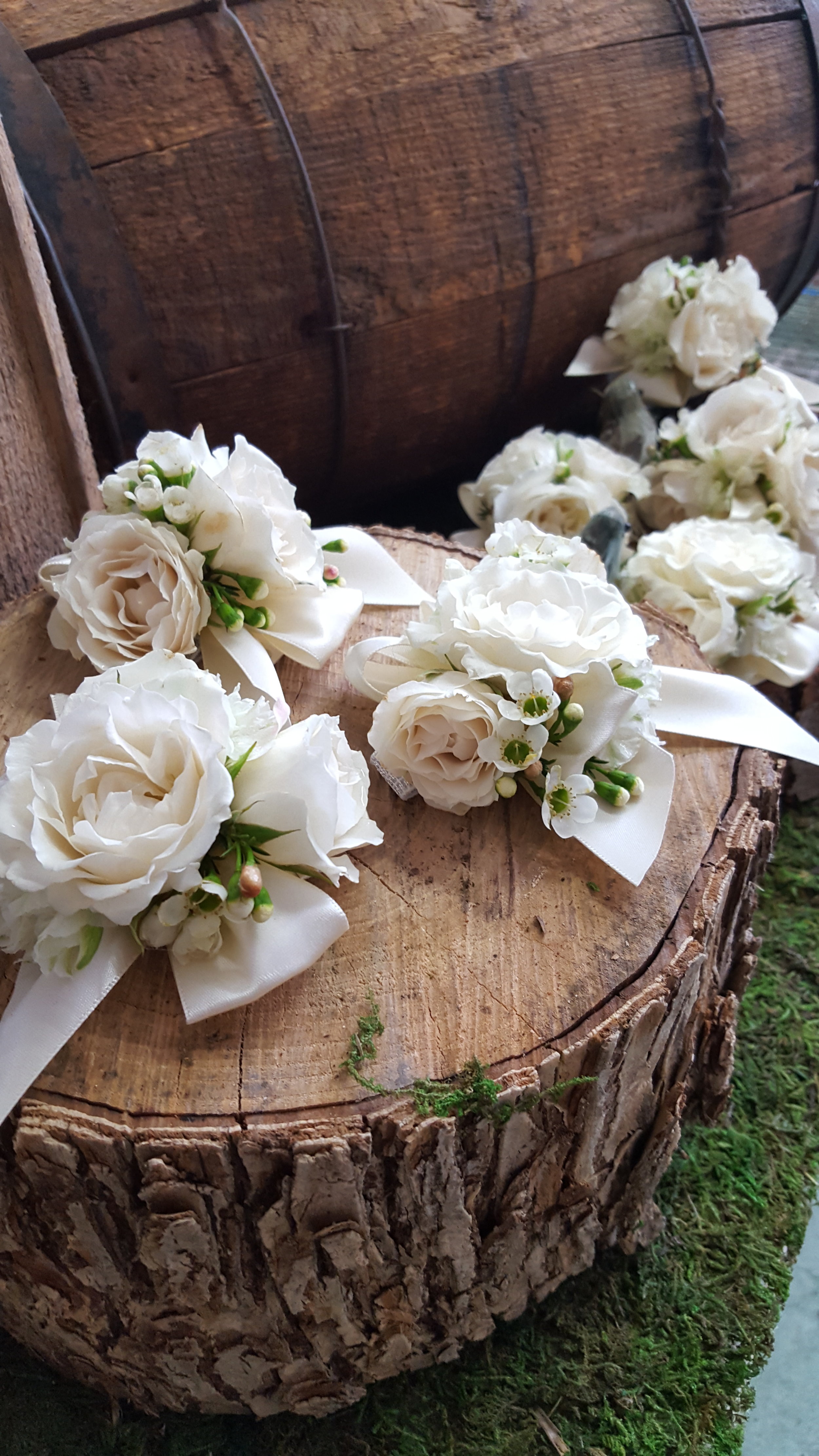 spray rose and waxflower corsages.jpg