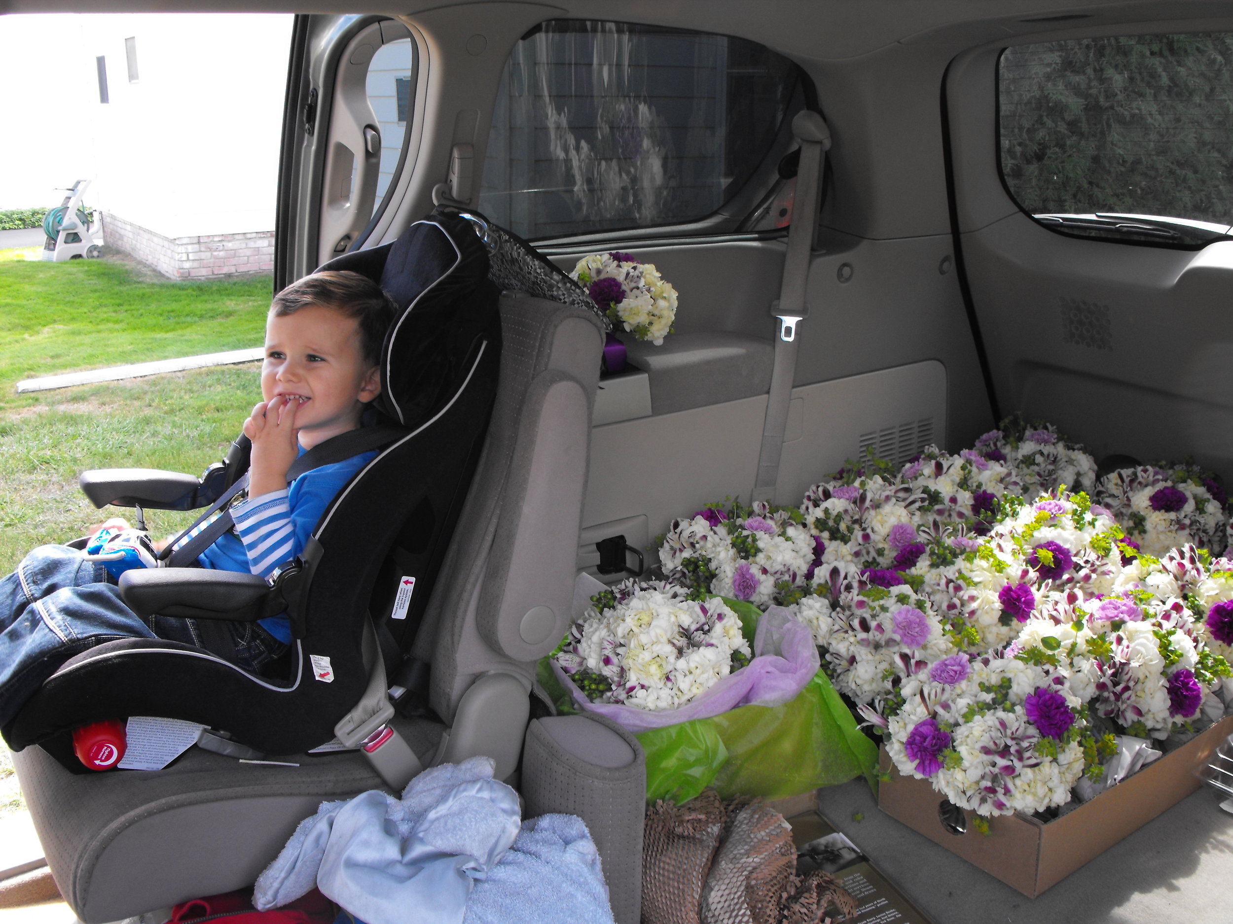 matty in car seat with flowers.JPG