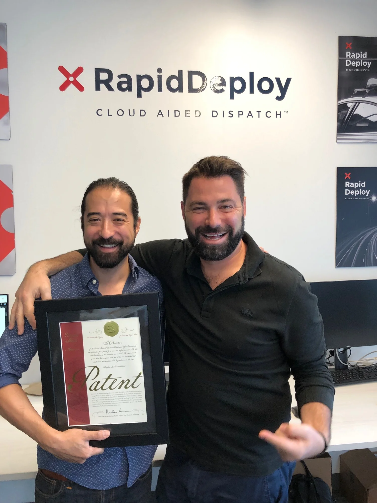 Justin Jensen and Steve Raucher with the awarded US patent 10,264,122 in Austin, TX