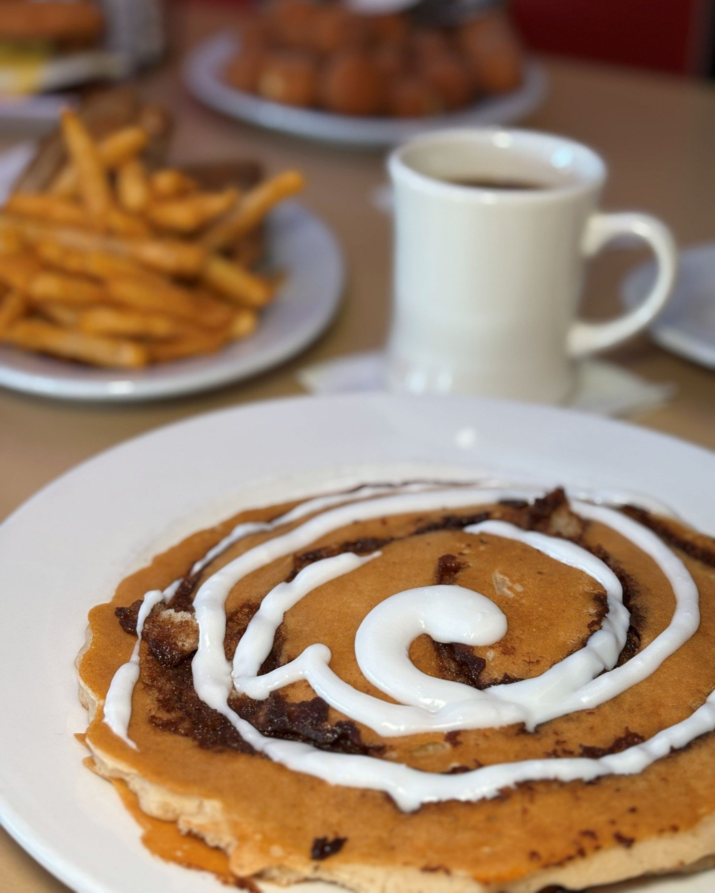 A sweet start to your morning. 🥞✨
Cinnamonbun Pancakes drizzled with vanilla glaze and paired with a hot cup of coffee!