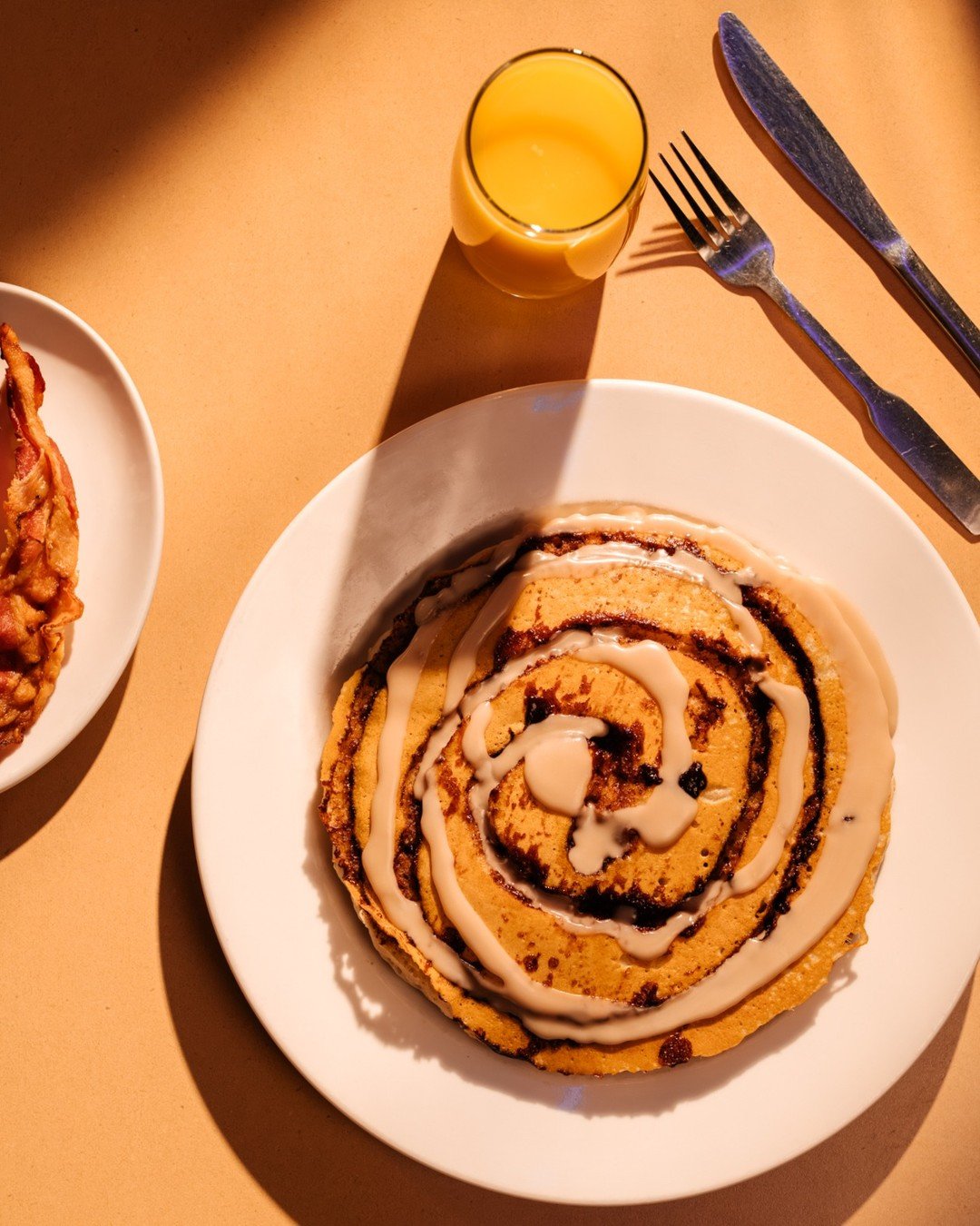 If you love a cinnamon bun, just wait...
Our Cinnamon Bun Pancakes are swirled with cinnamon sugar, then drizzled with vanilla glaze and finished with powdered sugar.

Soft, sweet, and just the right amount of indulgent.

Breakfast doesn&rsquo;t get 