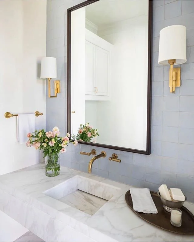 Beautiful powder vanity designer by @marieflaniganinteriors using @annsacks tile and @circalighting sconces