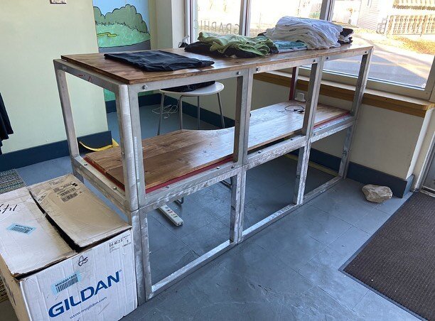 We try our hardest to be more eco conscious/friendly all the time. Sometimes that means getting creative and building a desk/counter out of retired  screen printing frames. It worked out pretty well and is surprisingly sturdy! Comment below and let u
