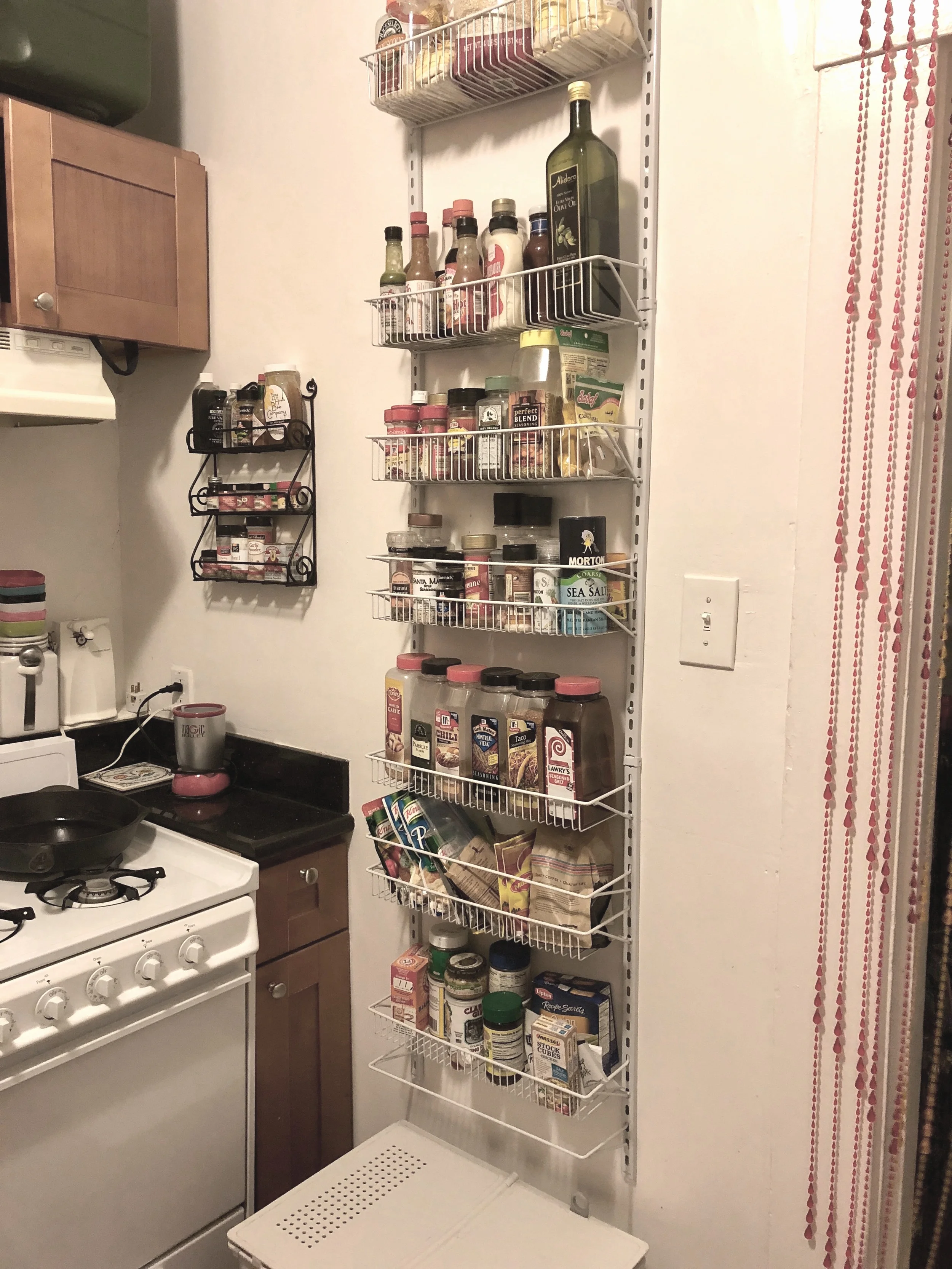 Wall mounted spice racks clear off counter clutter and allow you to see all of your spices at a glance.