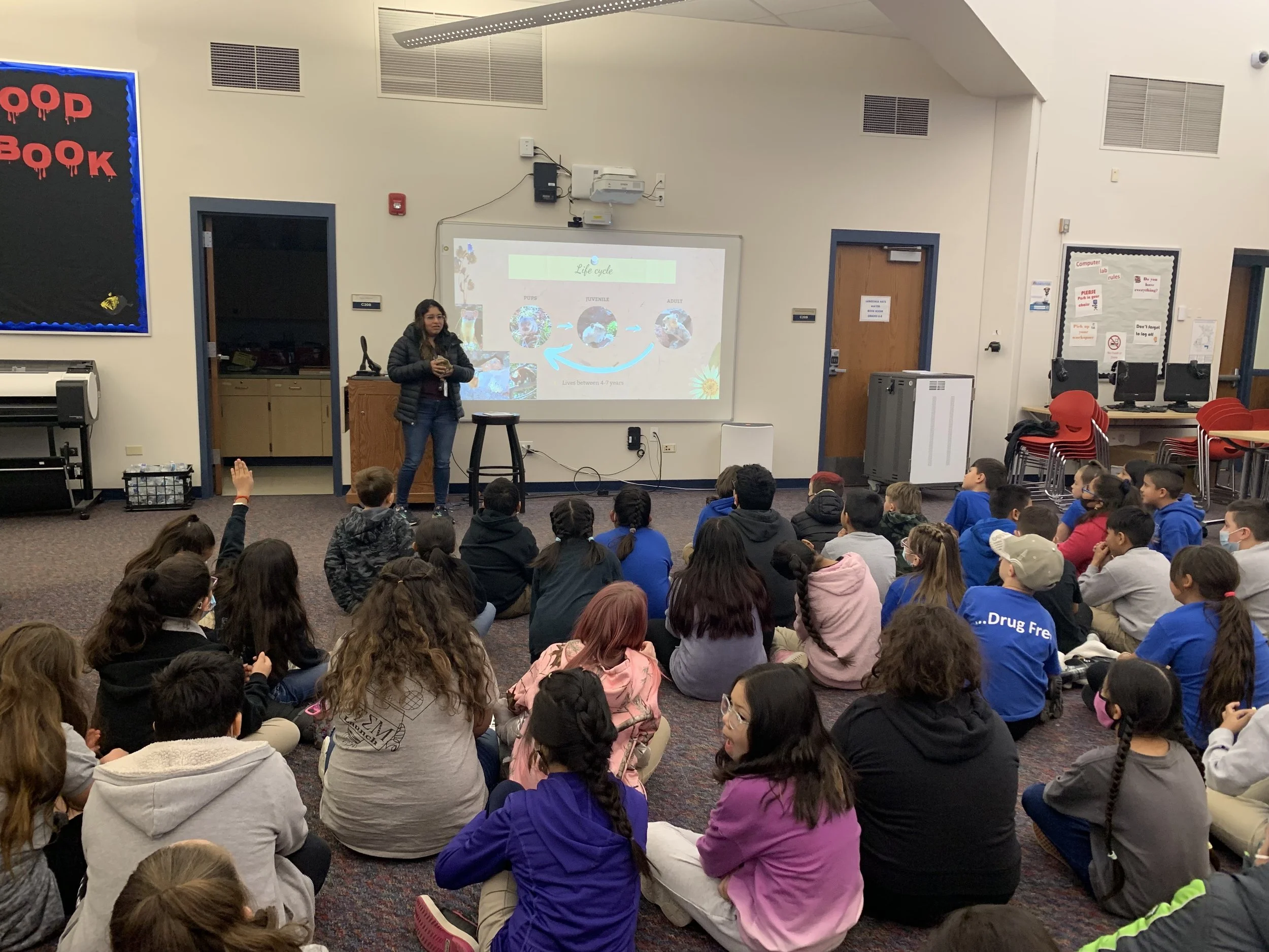 NWT Grad student Airy Peralta speaks with 3rd graders