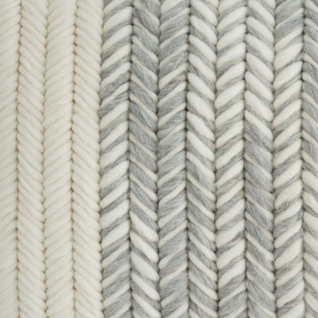 Close up of hand stitches for heathered gray cushion.