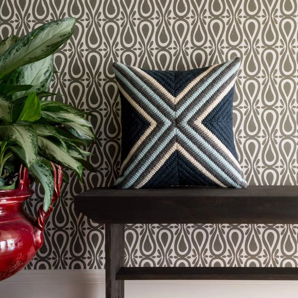 Navy Blue Cross Textured pillow shown with gray block printed wallpaper.
