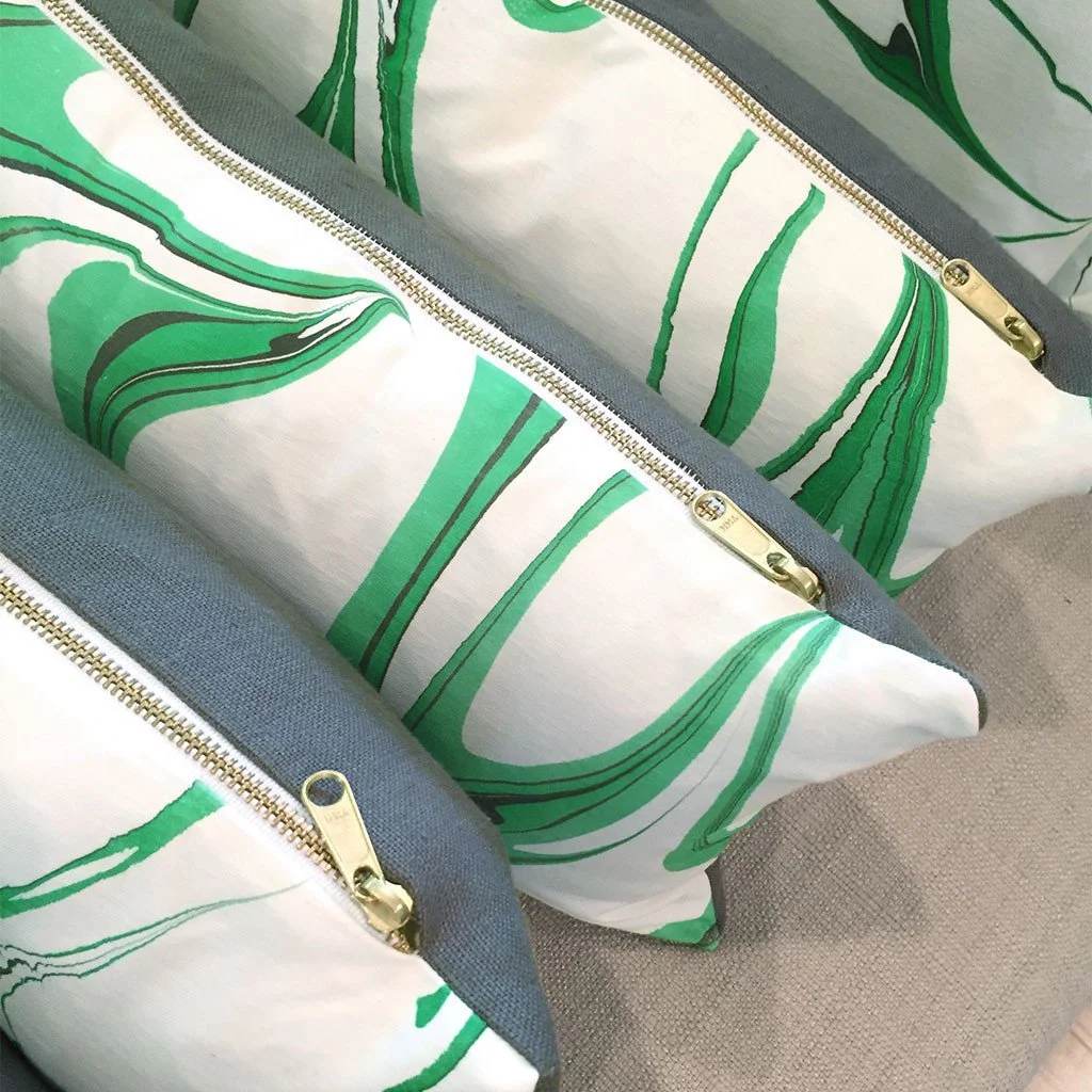 Artisan made hand marbled pillow with gold zippers, organic cotton front, and linen back.