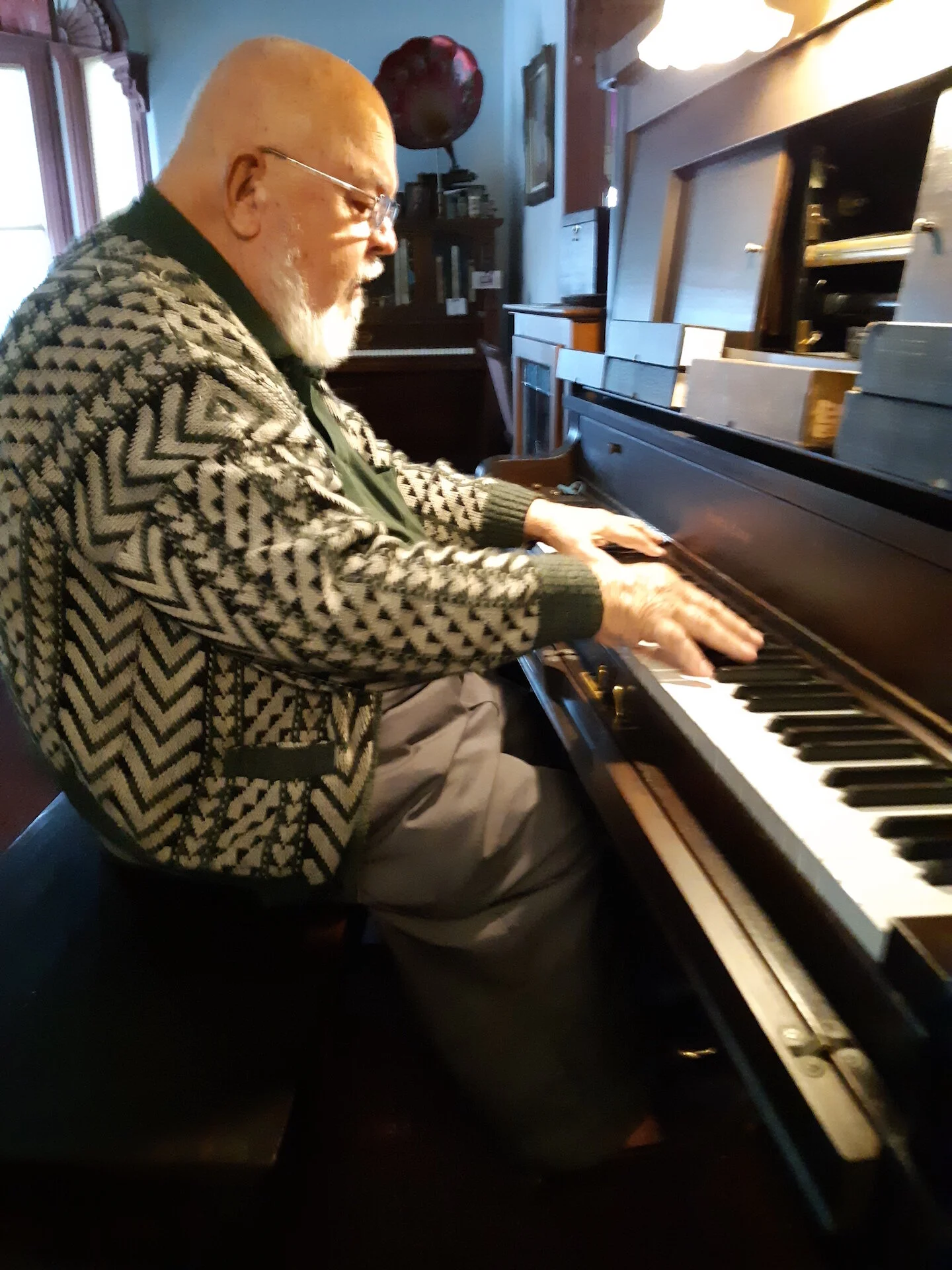 Photo #5 - Ken playing piano before he died.jpg