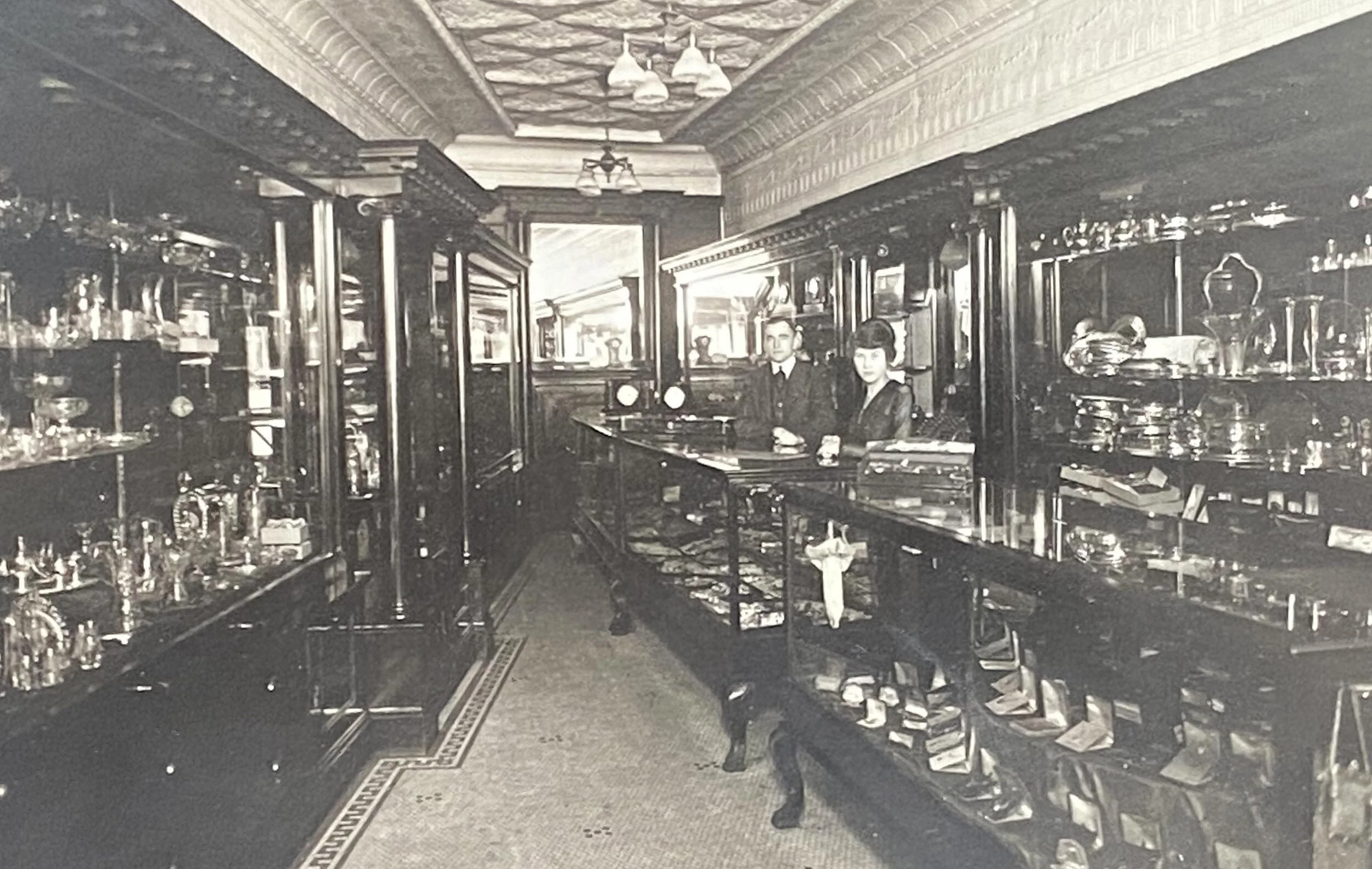 J. Pequegnat &amp; Son store interior in the 1920s. Ron’s parents Harold and Marguerite stand behind the counter.