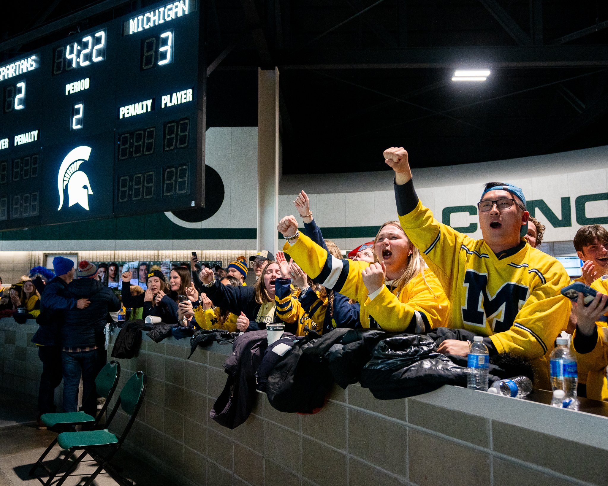 Michigan fans celebrate after the Wolverines took a 3-2 lead during the second period of the Big Ten Hockey Tournament championship game at Munn Ice Arena in East Lansing, Mich., Saturday, March 23, 2024. The goal was part of a rapid-fire second peri