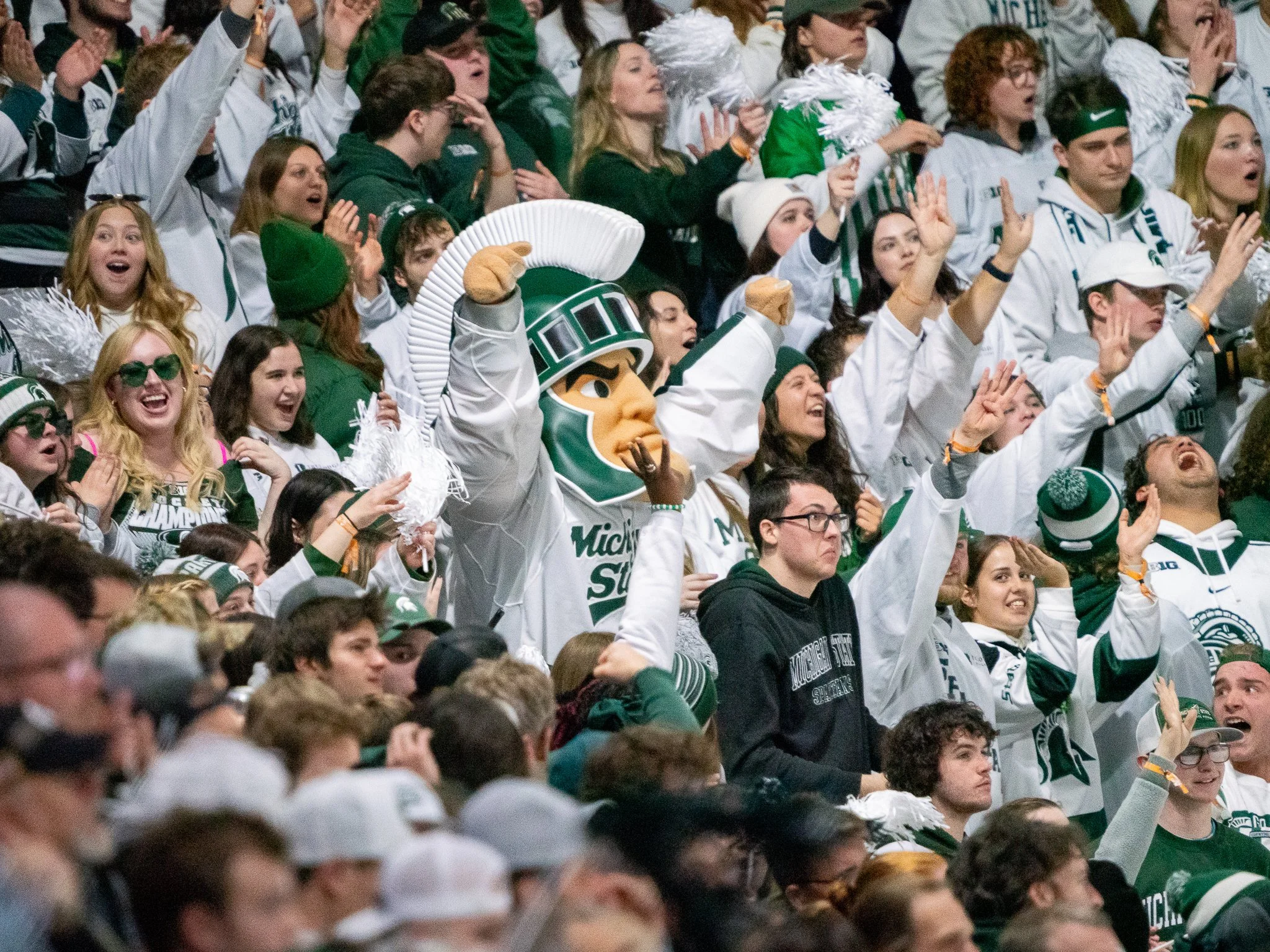 Michigan State mascot Sparty celebrates with fans in the stands after the Spartans scored the game-winning goal during overtime of the Big Ten Hockey Tournament championship game at Munn Ice Arena in East Lansing, Mich., Saturday, March 23, 2024. Fre
