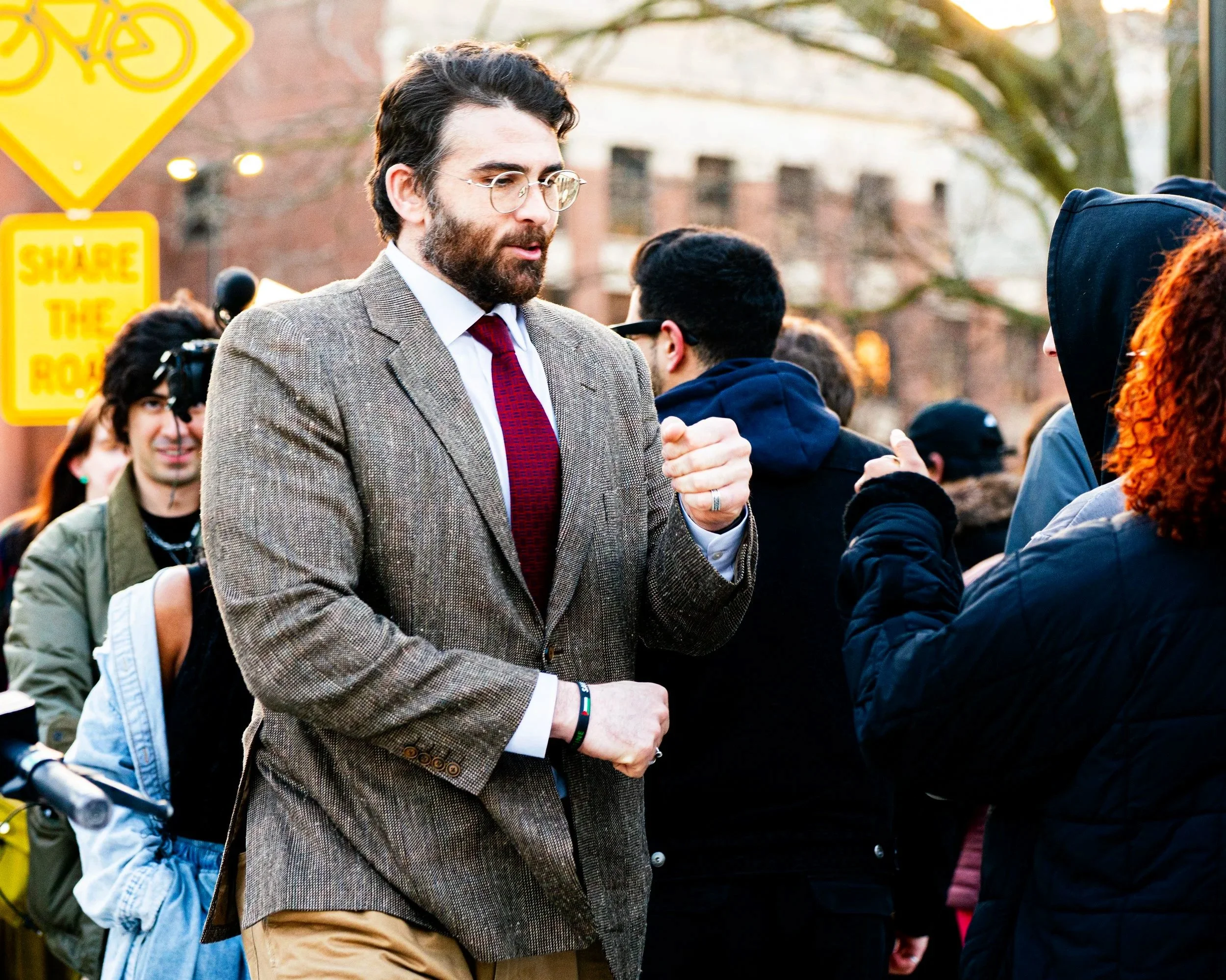 Political commentator Hasan Piker greets supporters outside a campaign event for U.S. Senate candidate Abdul El-Sayed at the University of Michigan in Ann Arbor, Mich., Tuesday, April 7, 2026. Hundreds of people queued in a line that stretched around