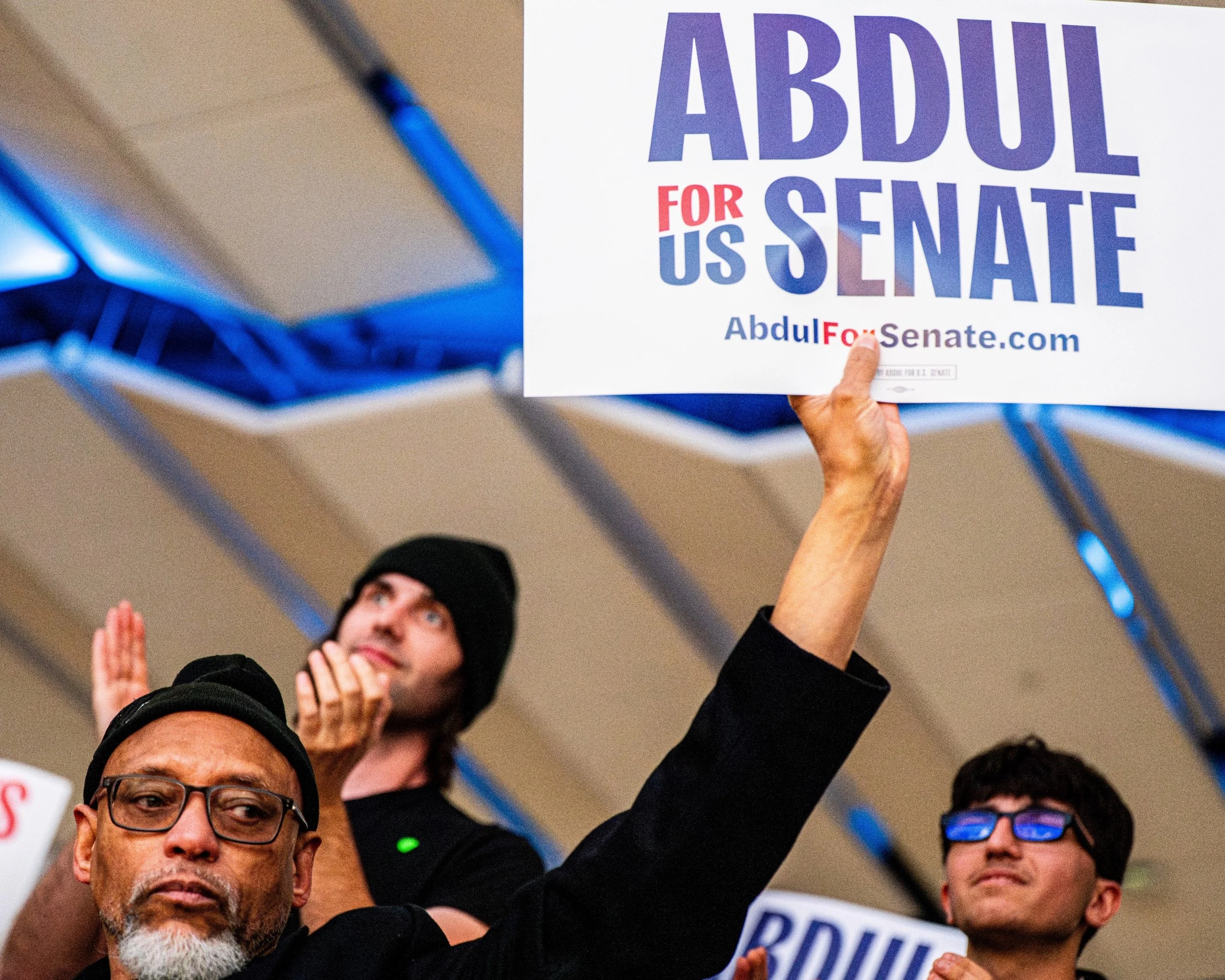 Richard Winston, 58, holds a campaign sign in support of U.S. Senate candidate Abdul El-Sayed during a rally at the University of Michigan in Ann Arbor, Mich., Tuesday, April 7, 2026.