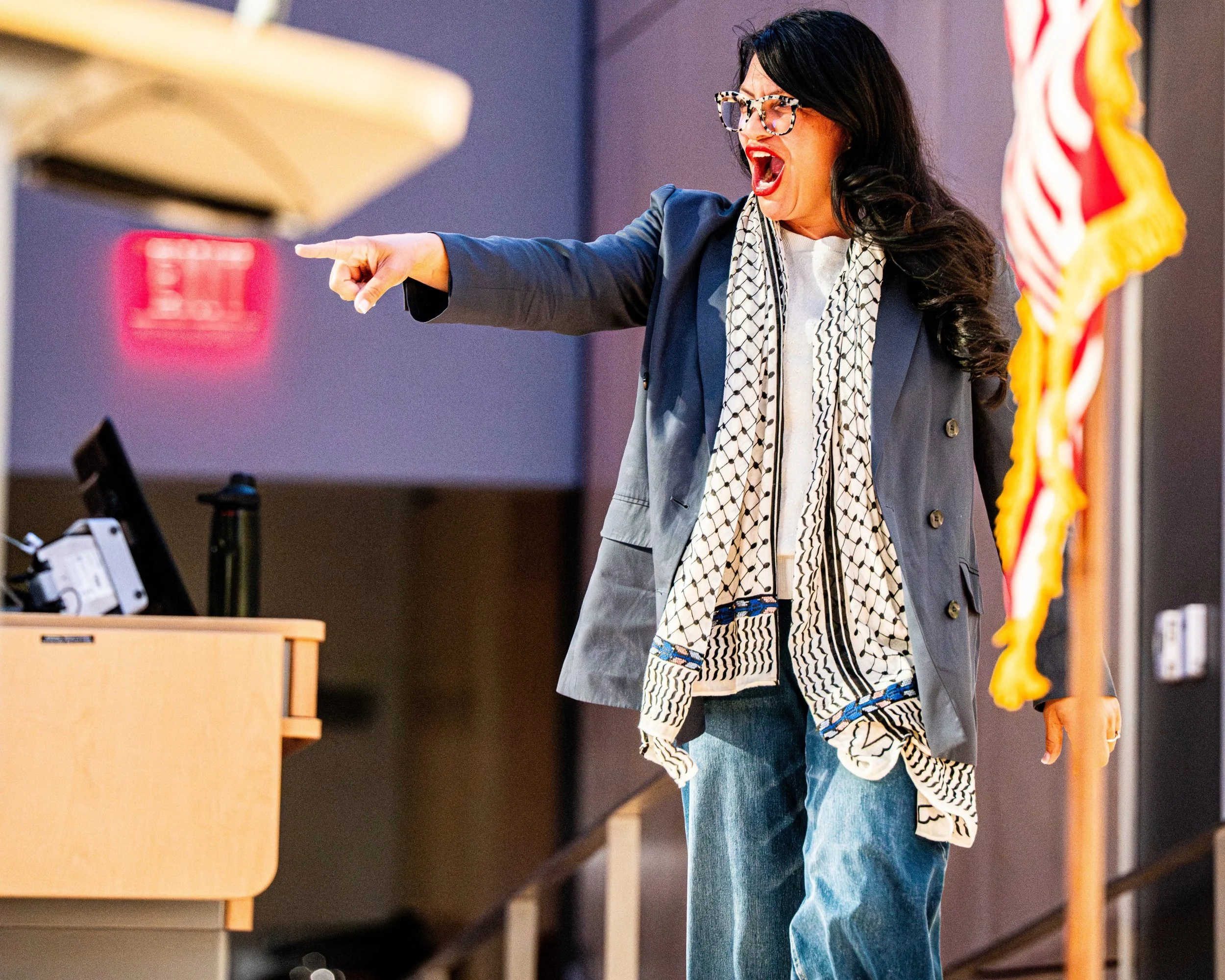 U.S. Rep. Rashida Tlaib approaches the microphone to deliver remarks during a campaign rally at the University of Michigan in Ann Arbor, Mich., Tuesday, April 7, 2026.
