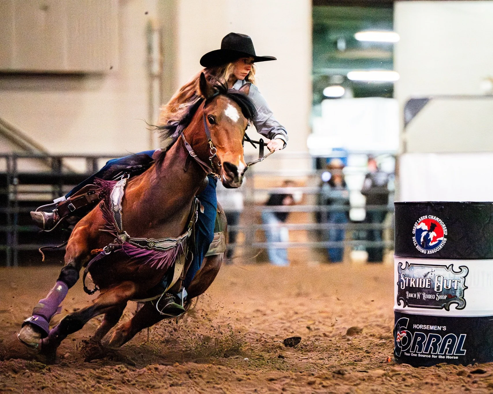 Kayla Johnson tightly turns around a barrel during the barrel racing competition at the Michigan Horse Expo inside the MSU Pavilion. The three-day expo is one of the Midwest's premier equestrian events, drawing thousands of spectators and top-tier re
