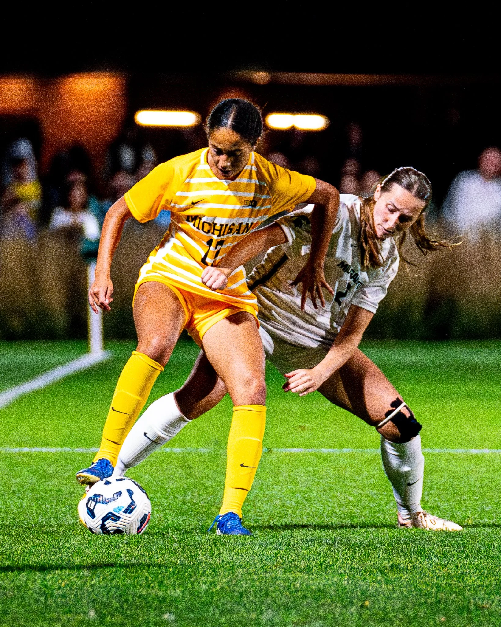 Michigan State Spartans defender Sofia Beerworth (2) anchors her position as Michigan Wolverines defender Christa Hayden (11) shields the ball during the second half at DeMartin Stadium.