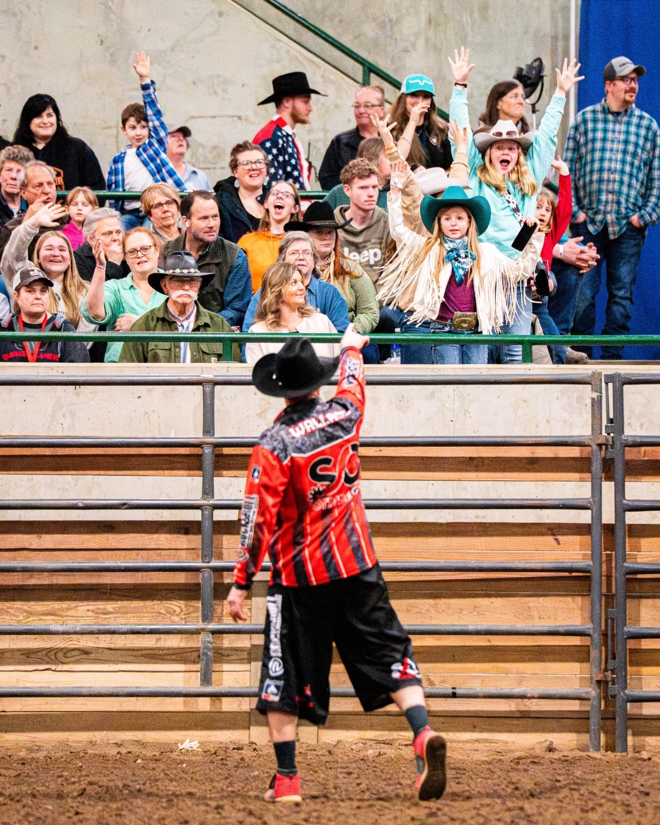 The event barrelman entertains the crowd between rides during the Great Lakes Championship Bull Riding finals at the Michigan Horse Expo inside the MSU Pavilion.