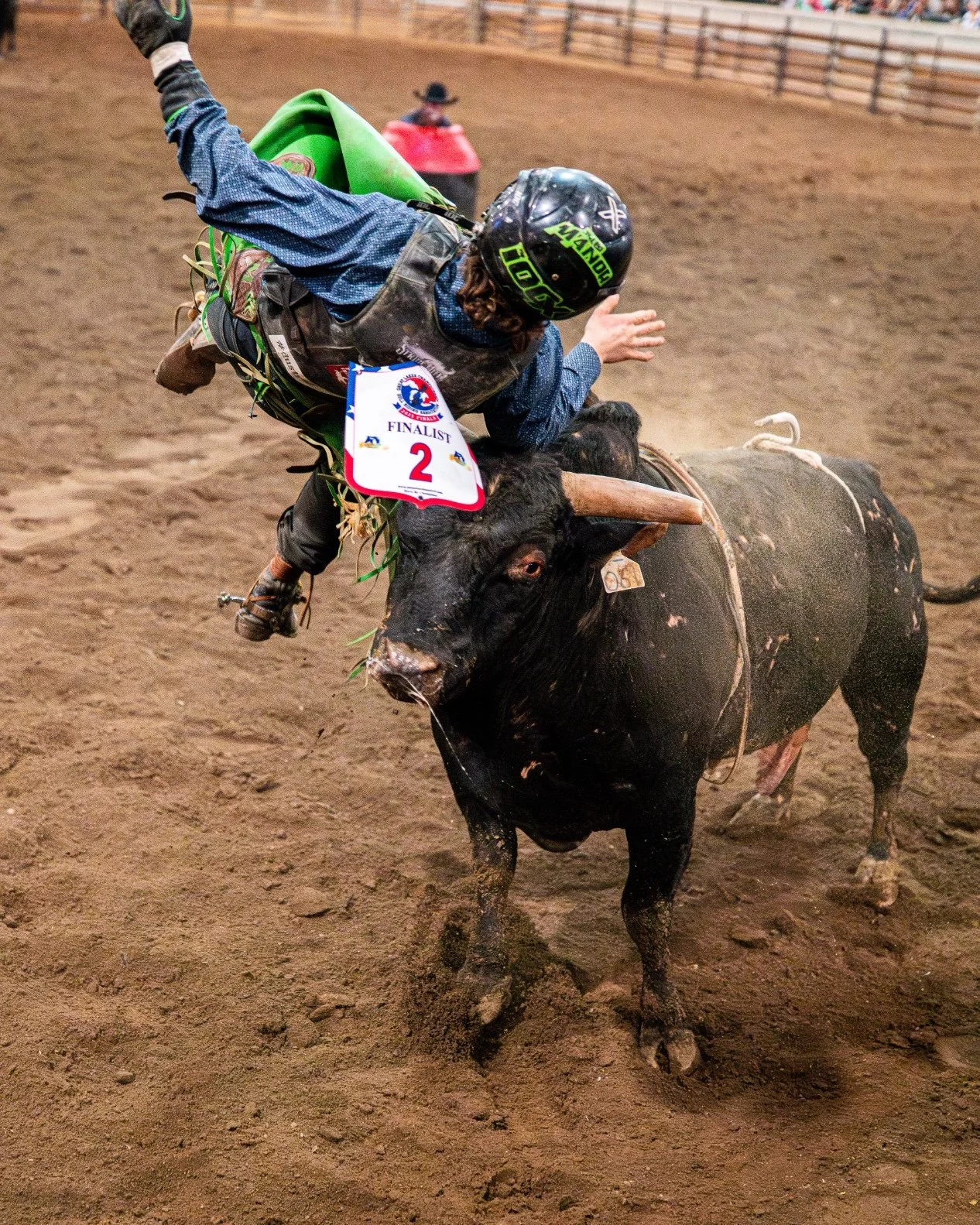 Professional bull rider Tyler Manor is thrown into the air by a bucking bull during the Great Lakes Championship Bull Riding finals at the Michigan Horse Expo inside the MSU Pavilion.