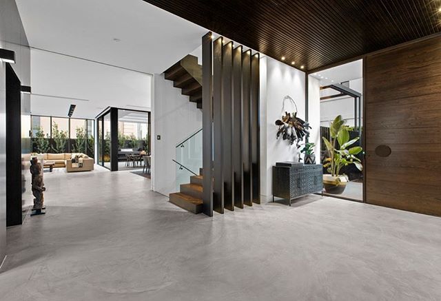 X-Bond Seamless Stone from entry to living, dining and kitchen.