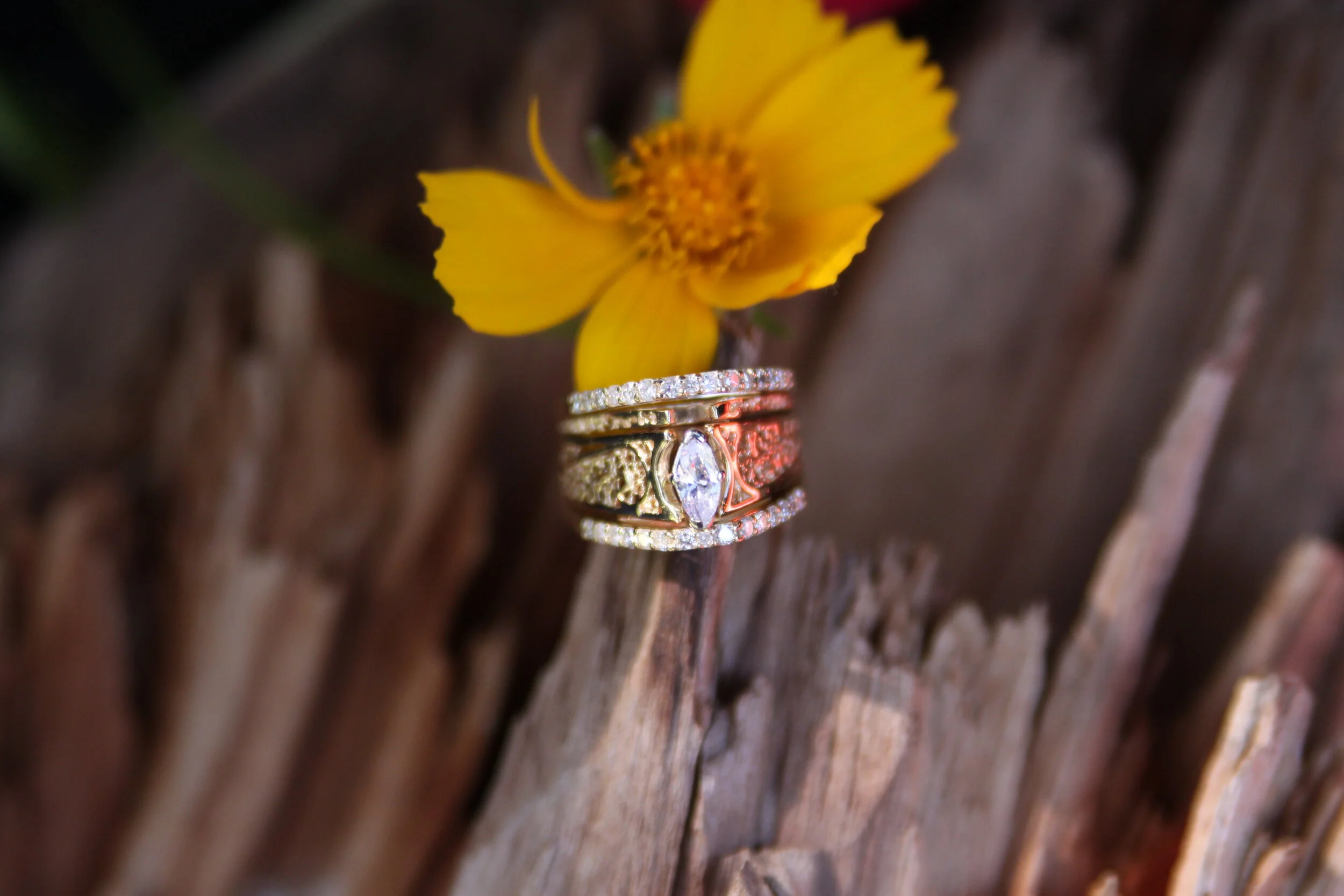 this wedding set also has anniversary bands added. The diamonds in these bands match the center stone of the ring to compliment the center marquise stone without stealing center stage.