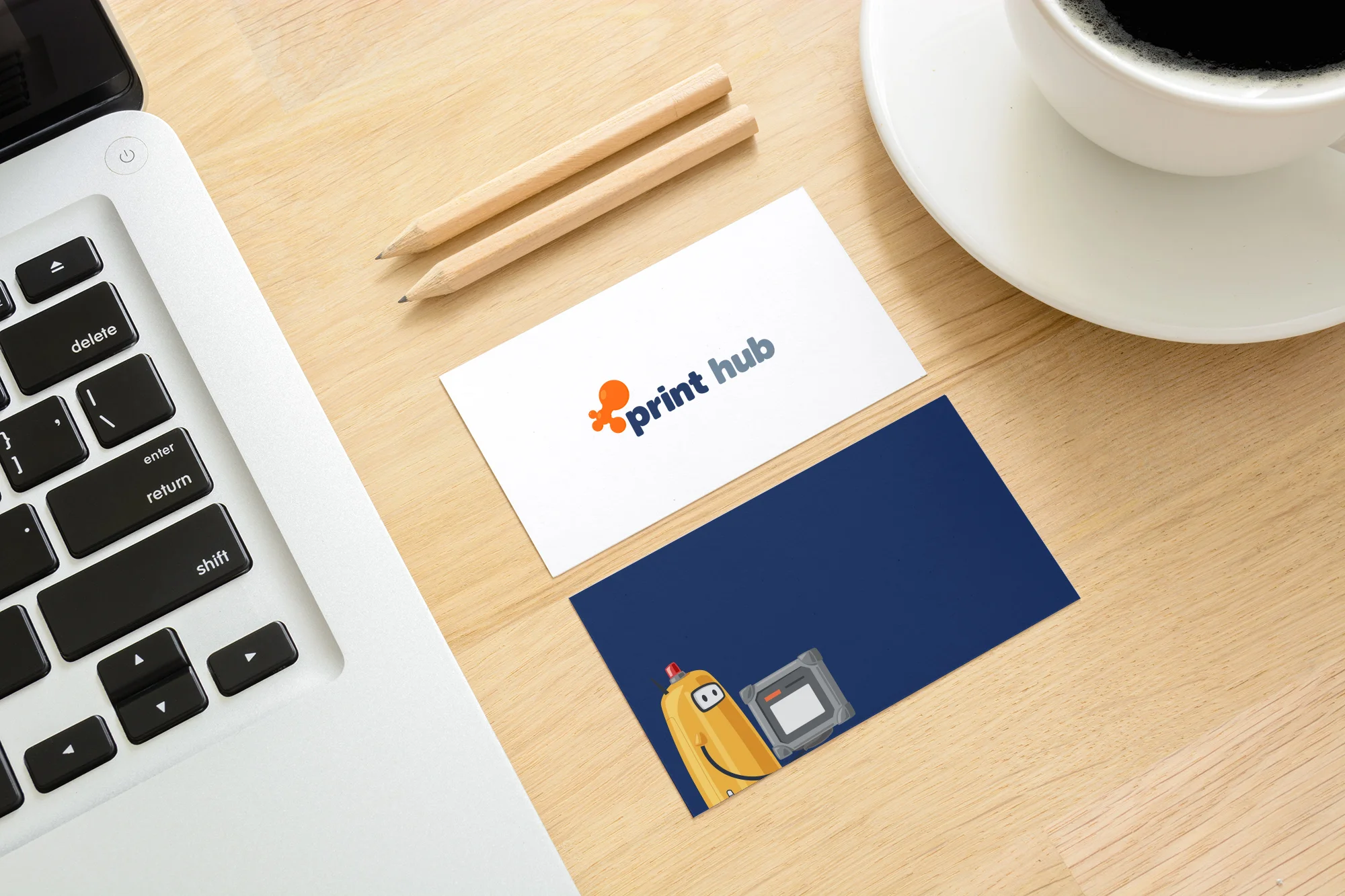 business card printing by Print Hub on a coffee table
