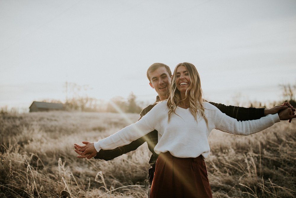  Couple smiles at camera. 