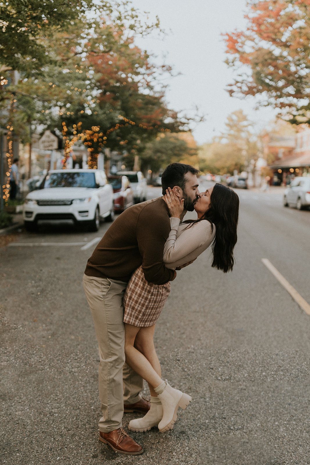  Couple kisses in the street. 