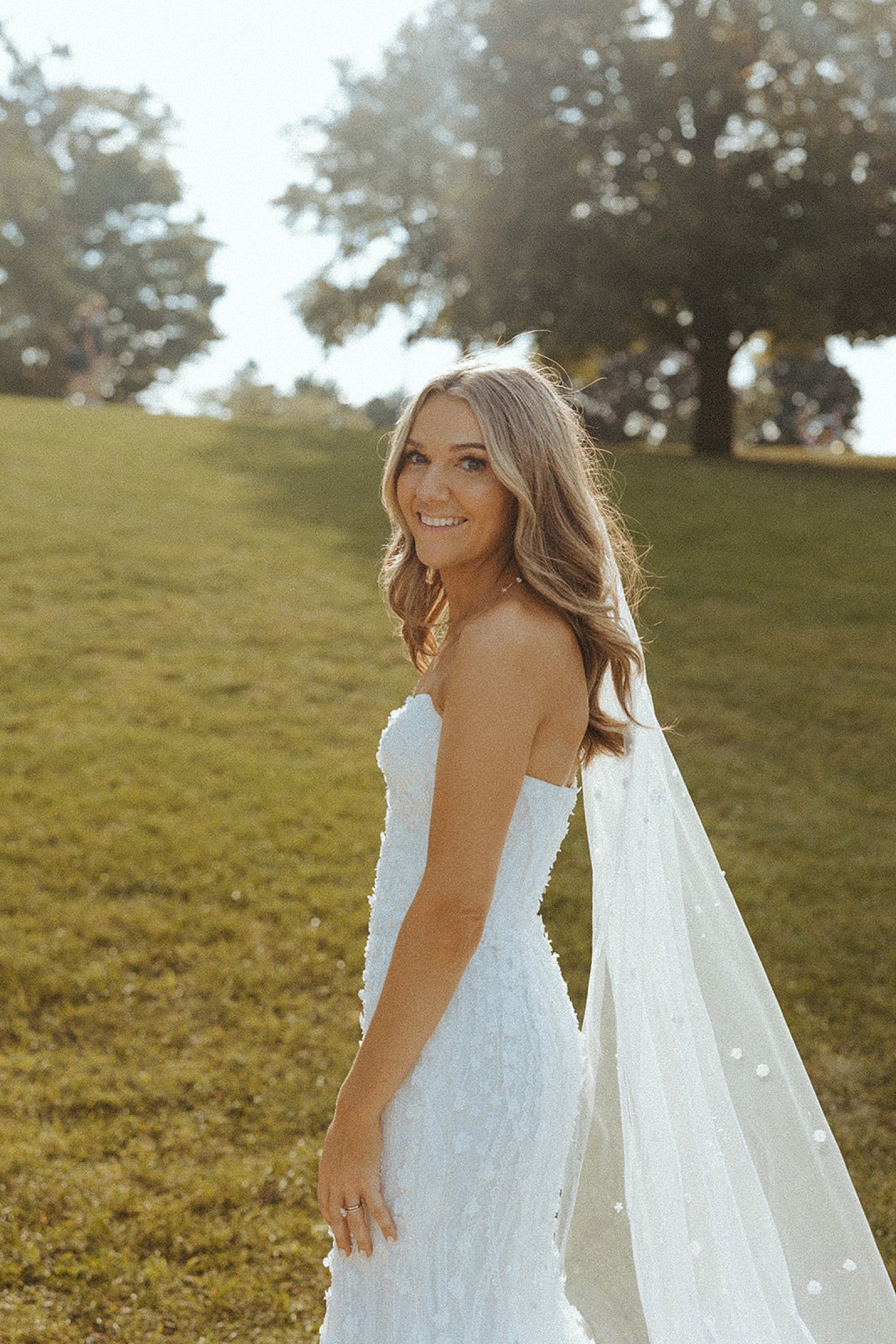  bride on a lawn at sunset by Steph Photo Co 