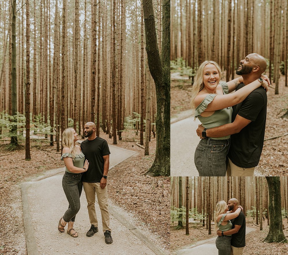  engaged couple hugging in the woods by Michigan wedding photographer  