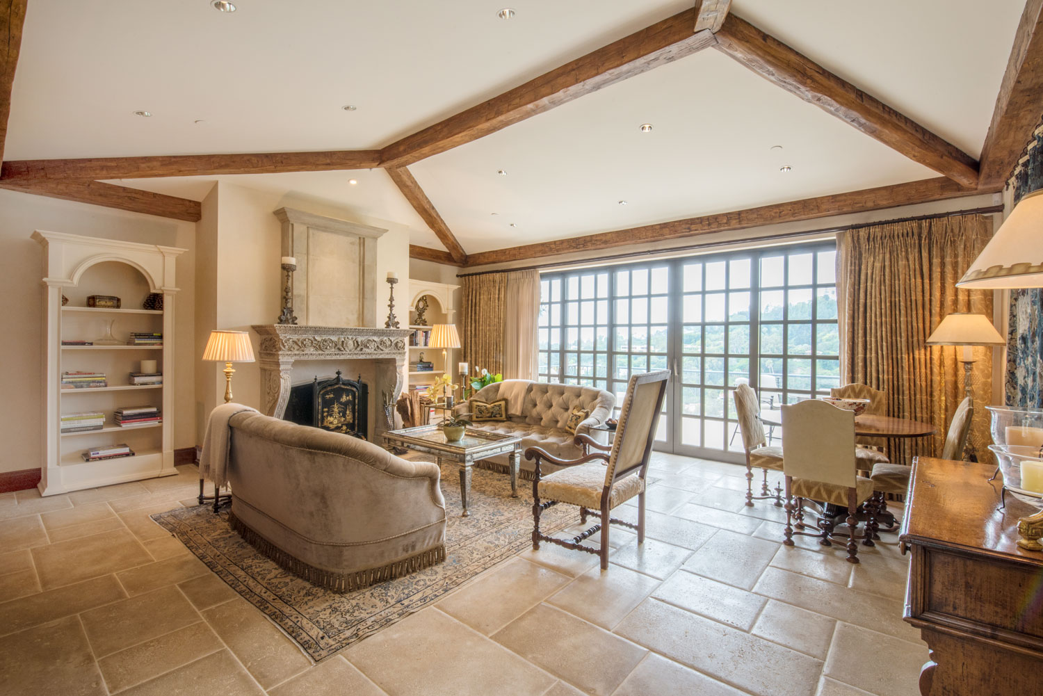 08-traditional-living-room-beamed-ceiling-tile-floor-ornate-fireplace-surround-gary-drake-general-contractor.jpg