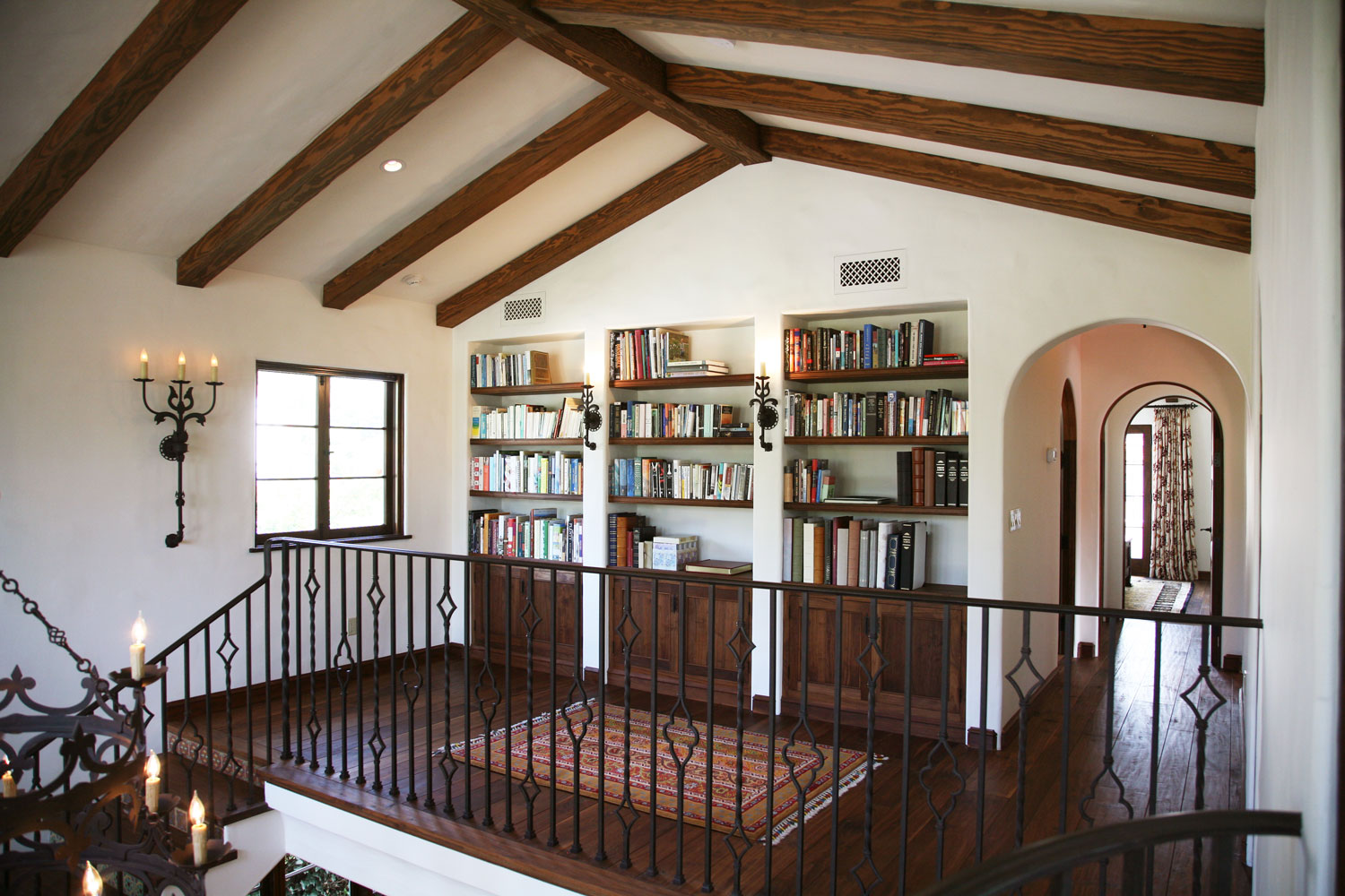 10-spanish-style-staircase-landing-beamed-ceiling-built-in-bookcases-gary-drake-general-contractor.jpg