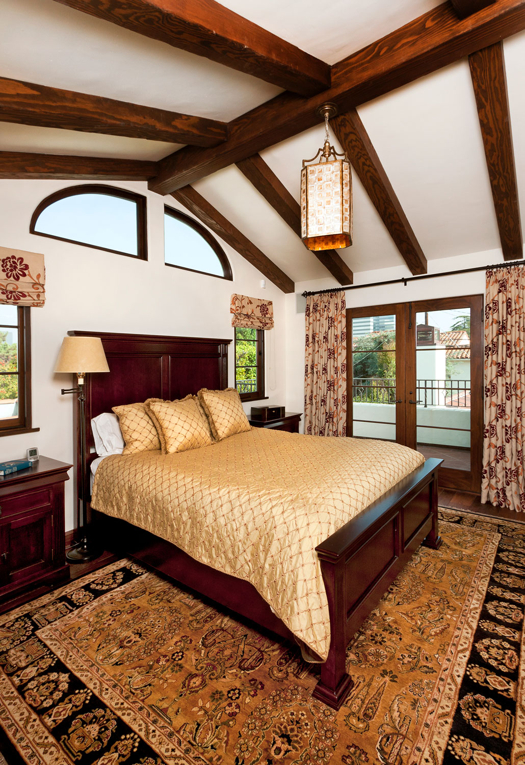 11-spanish-style-master-bedroom-beamed-ceiling-gary-drake-general-contractor.jpg
