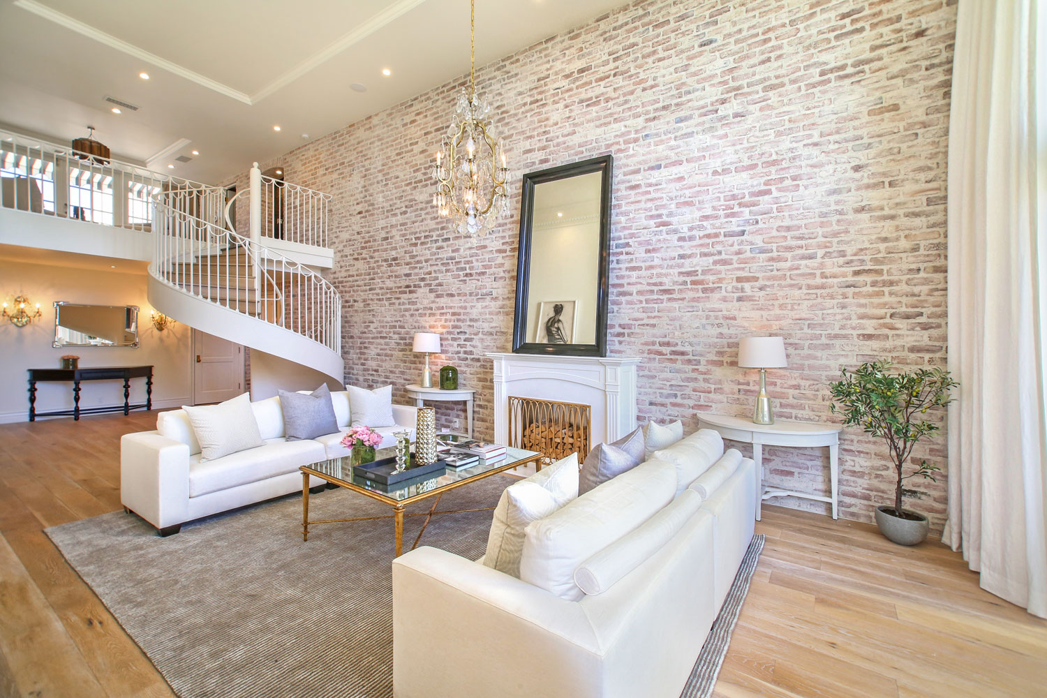 01-exposed-brick-walls-spiral-staircase-wide-plank-floors-gary-drake-general-contractor.jpg