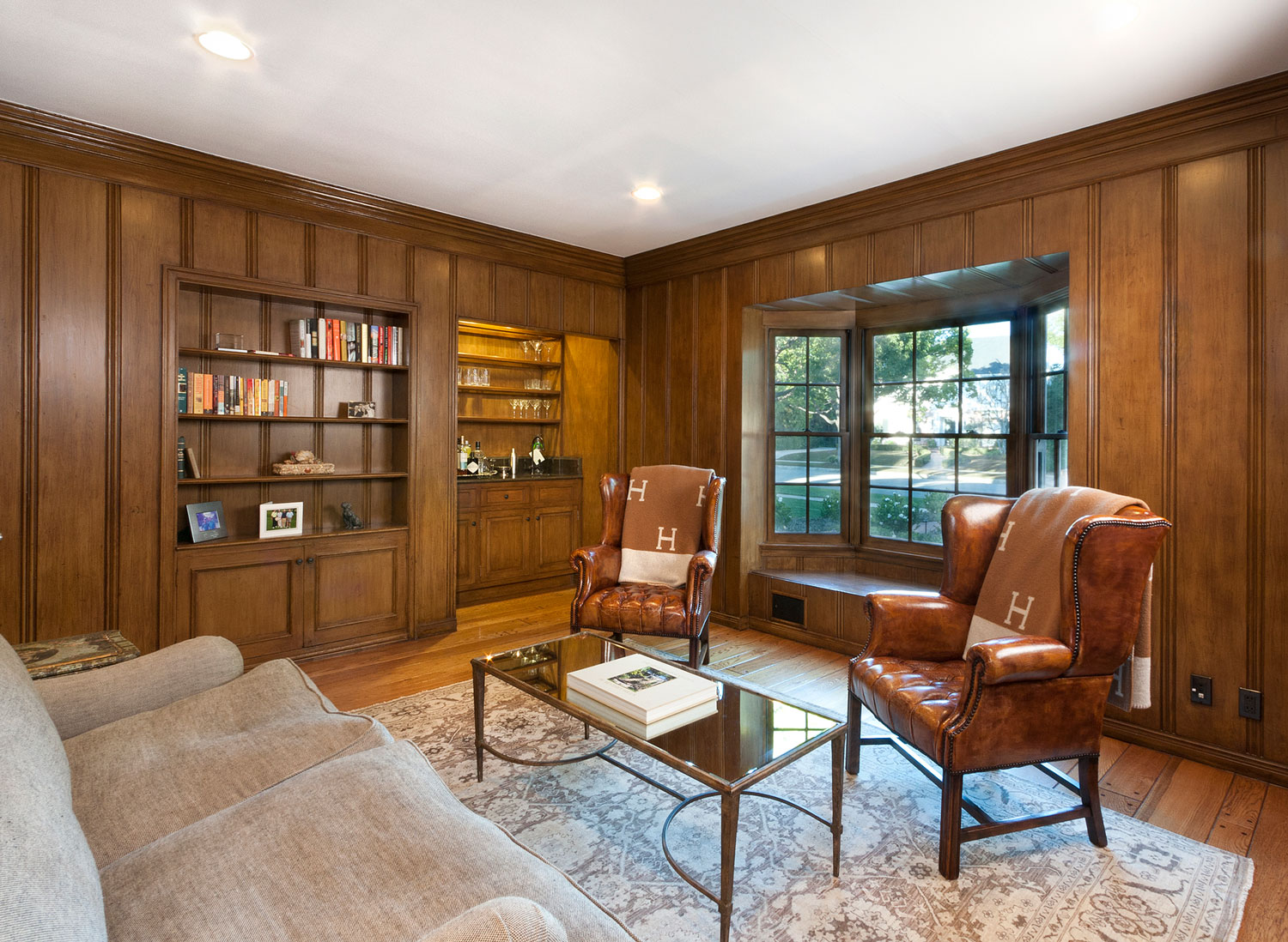 07-wood-paneled-home-office-built-in-shelves-window-seat-gary-drake-general-contractor.jpg
