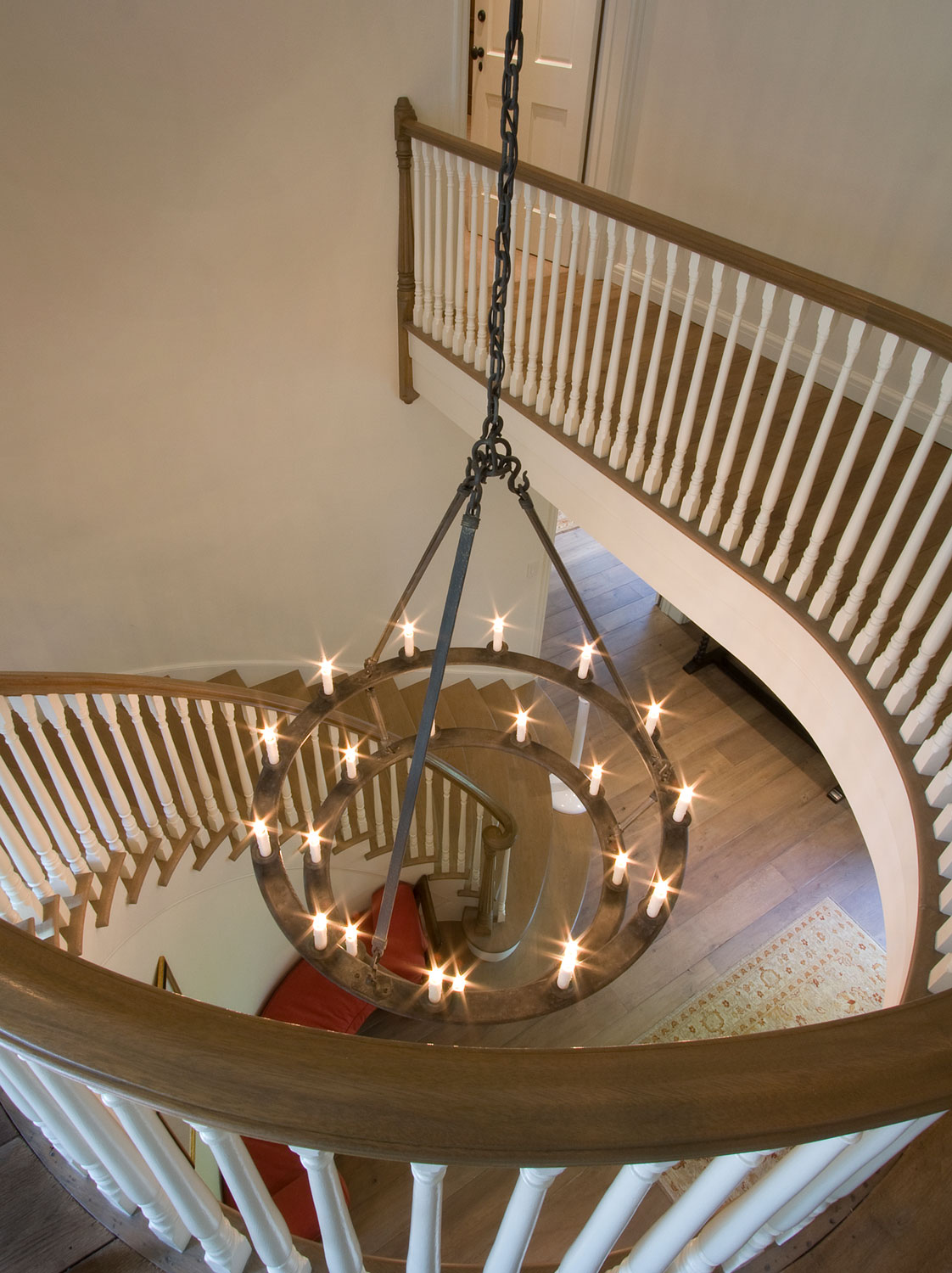 09-A-traditional-staircase-wood-railing-curved-gary-drake-general-contractor.jpg