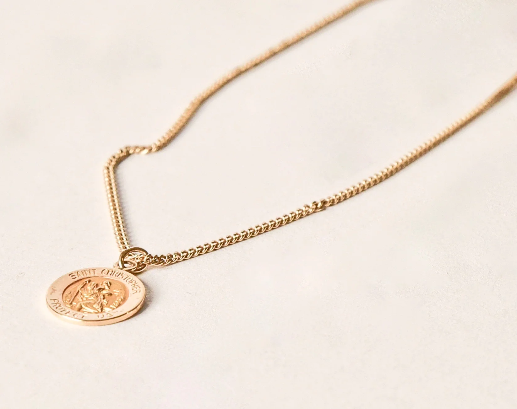 14k gold saint pendant with curb chain