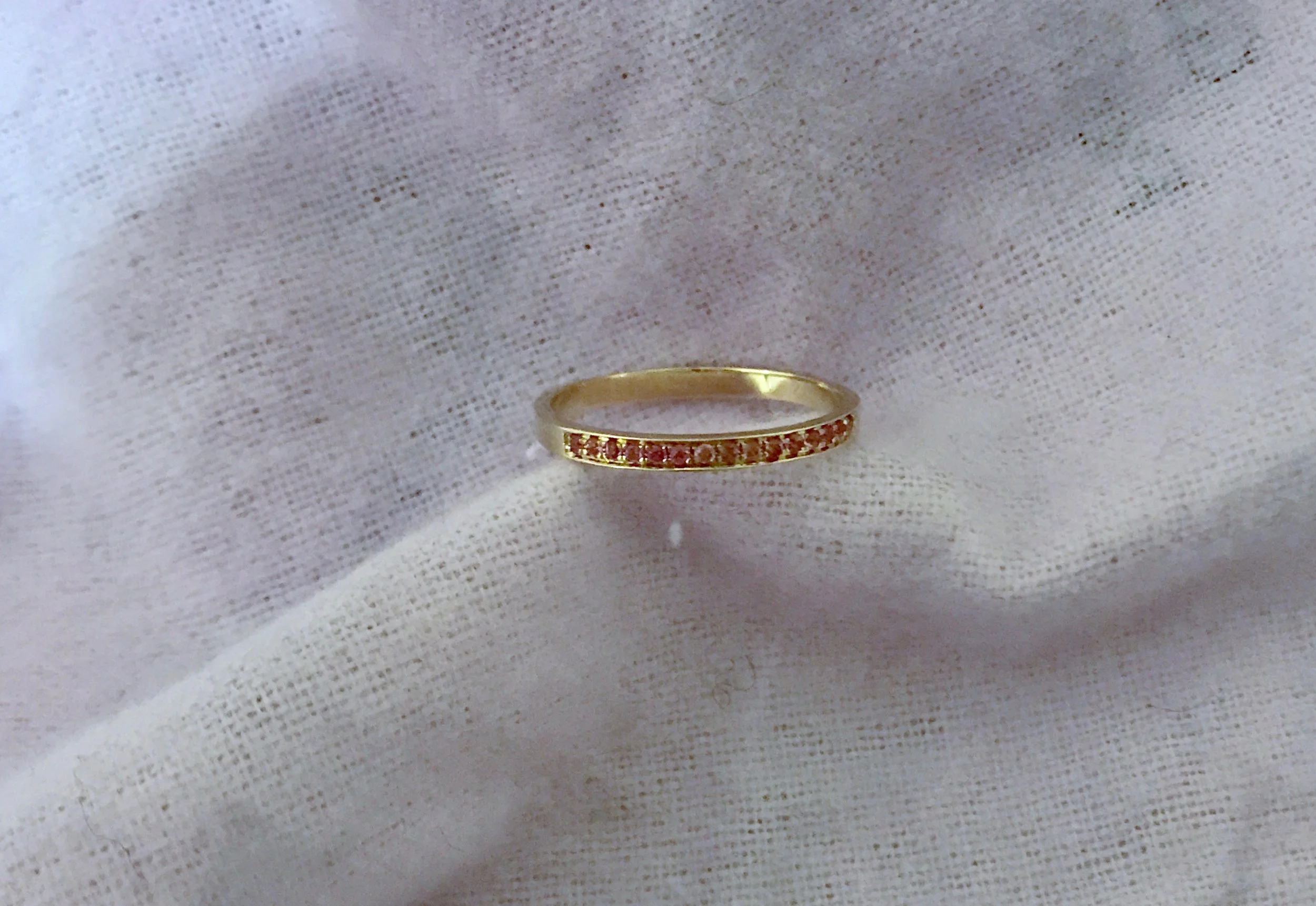 14k band with pink sapphires set 3/4 