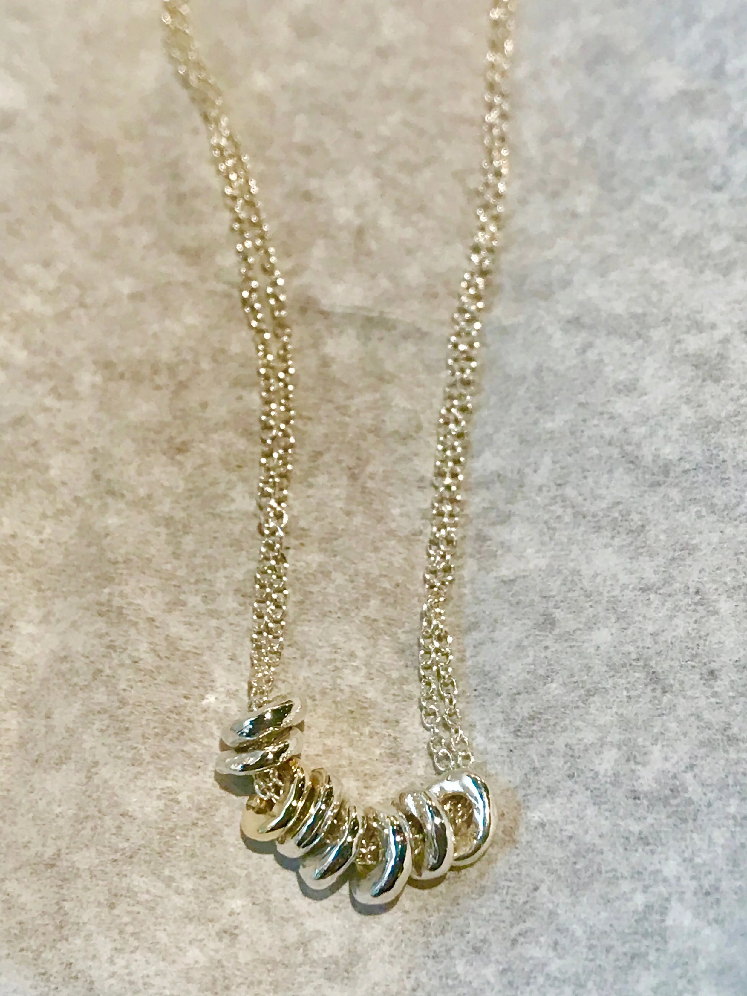 Sterling silver shells on a chain with single gold charm
