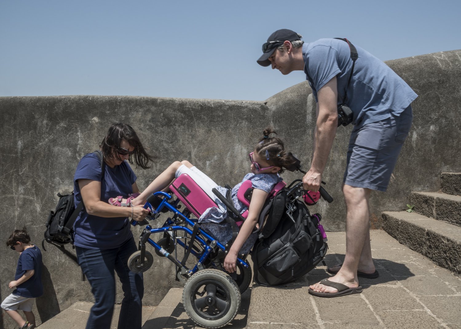 19. Ariel and Iris lift Kereni in her wheelchair at the Bandra Fort | NIK_1824.jpg