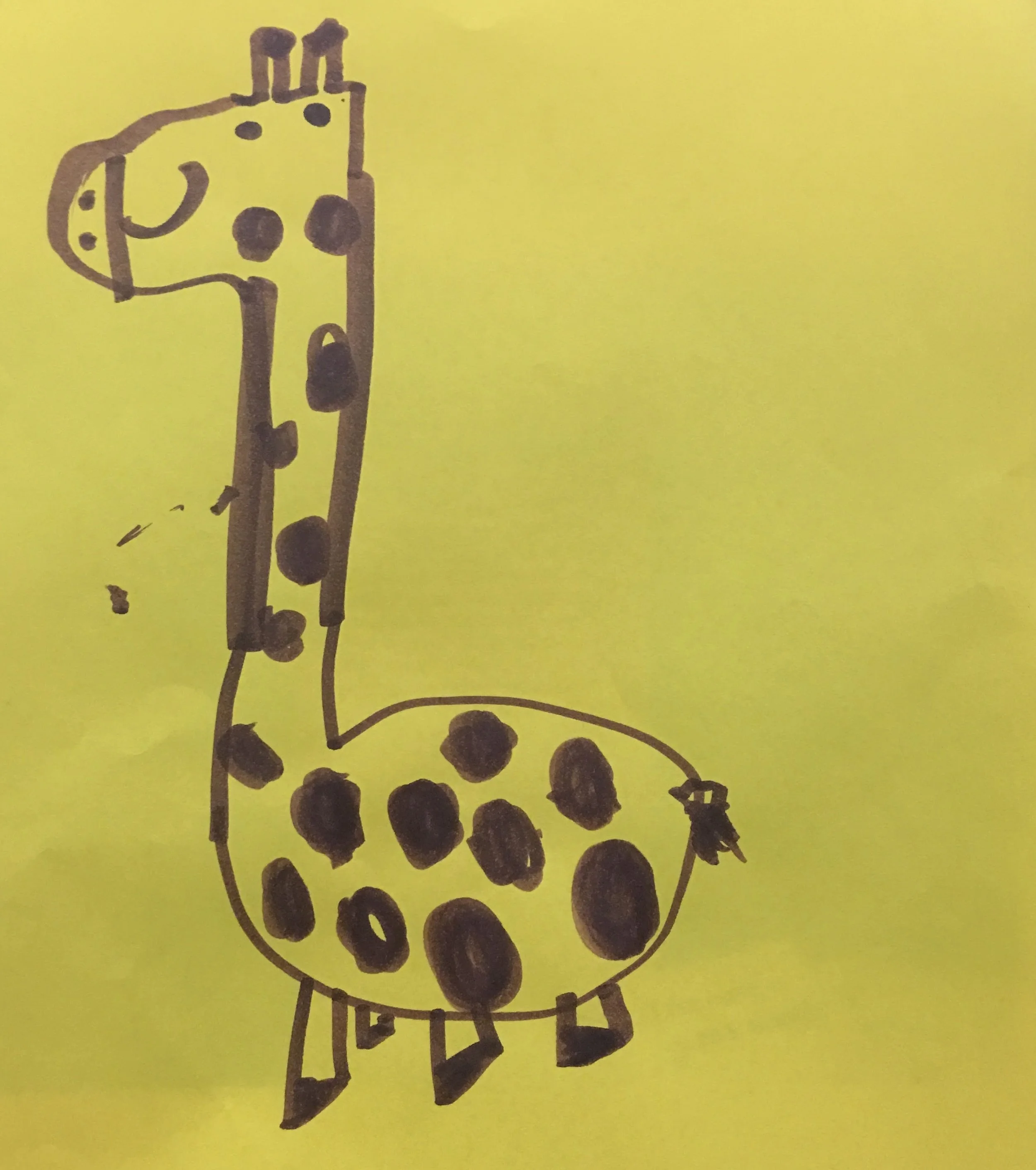 Hand-drawn illustration of a giraffe on yellow paper, with black spots, legs, and facial features.