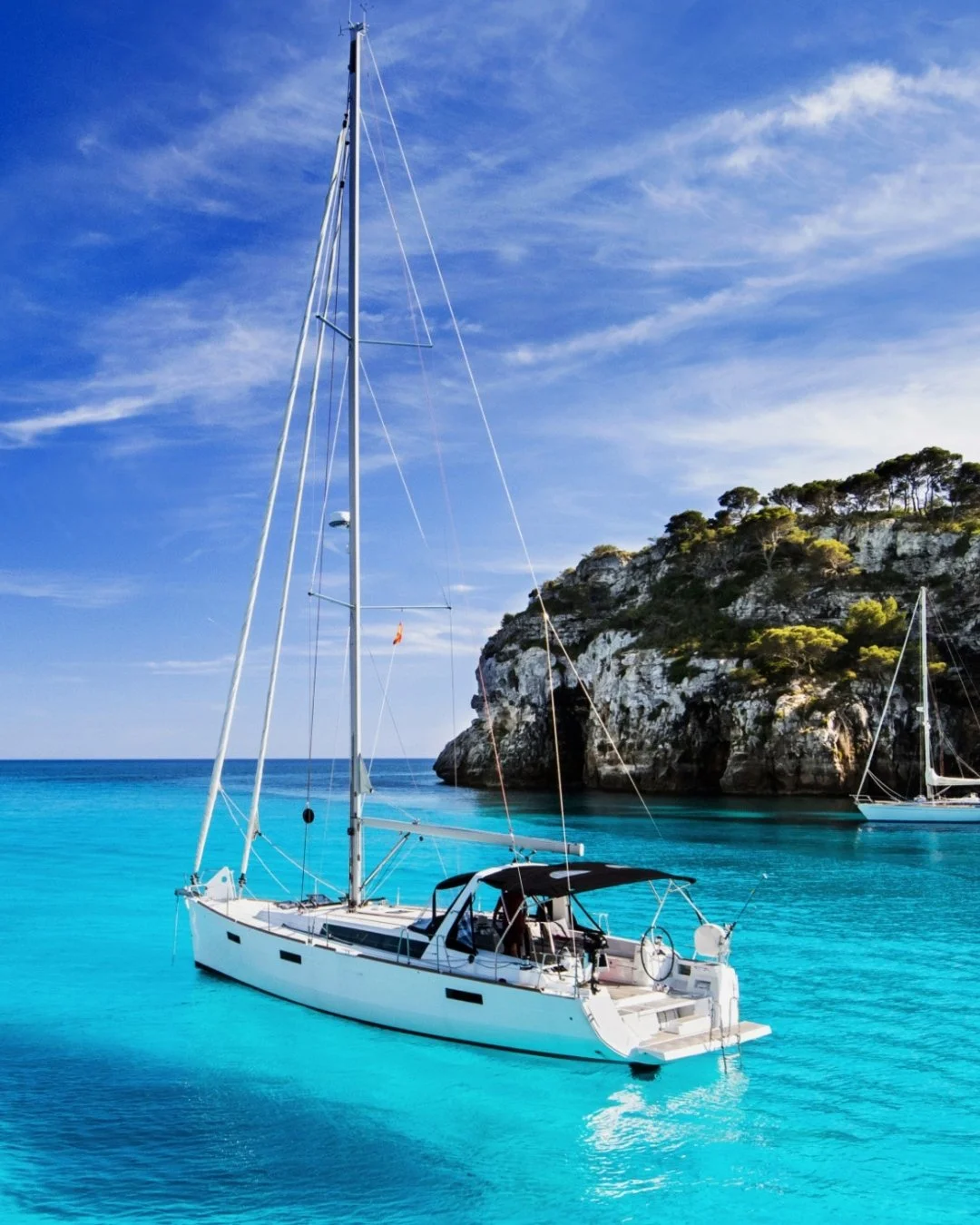 Menorca is the Mediterranean as it once was. Far from the see-and-be-seen rhythm of its Balearic neighbors, this island unfolds in secret coves, pine-fringed coastal paths, golden evenings, and seaside lunches that linger long past sunset. It's a pla