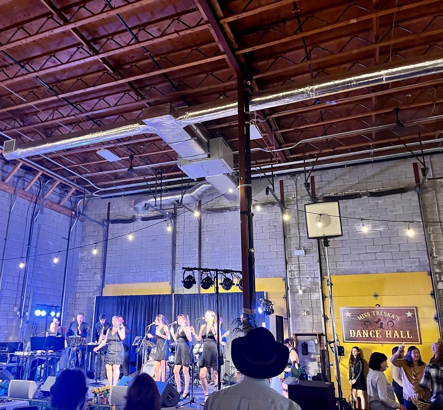 The Midnights performing at a fundraiser for The Mustard Seed food rescue distribution centre hosted by the Rotary Club Victoria, 2022