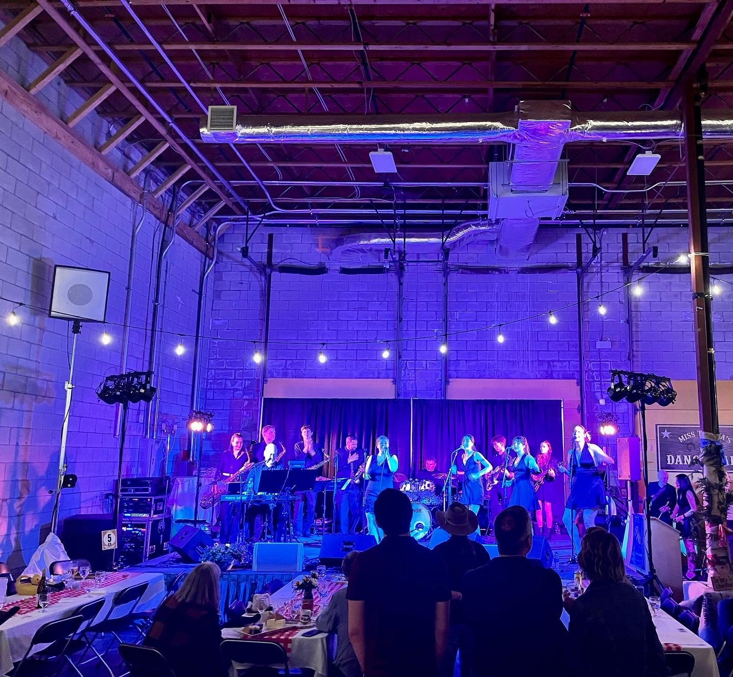 The Midnights performing at a fundraiser for The Mustard Seed food rescue distribution centre hosted by the Rotary Club Victoria, 2022