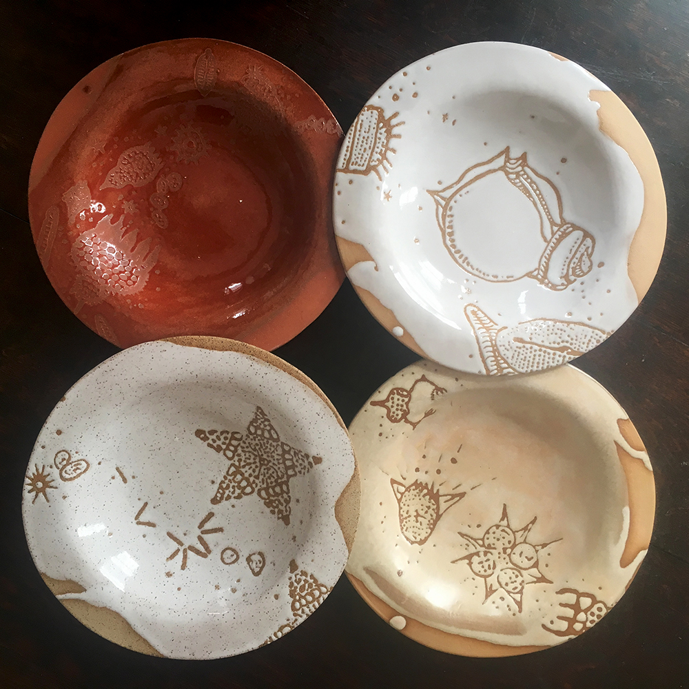  Low bowls in plum on red clay, white on blush clay, créme brûlée on blush clay and white on speckle clay 