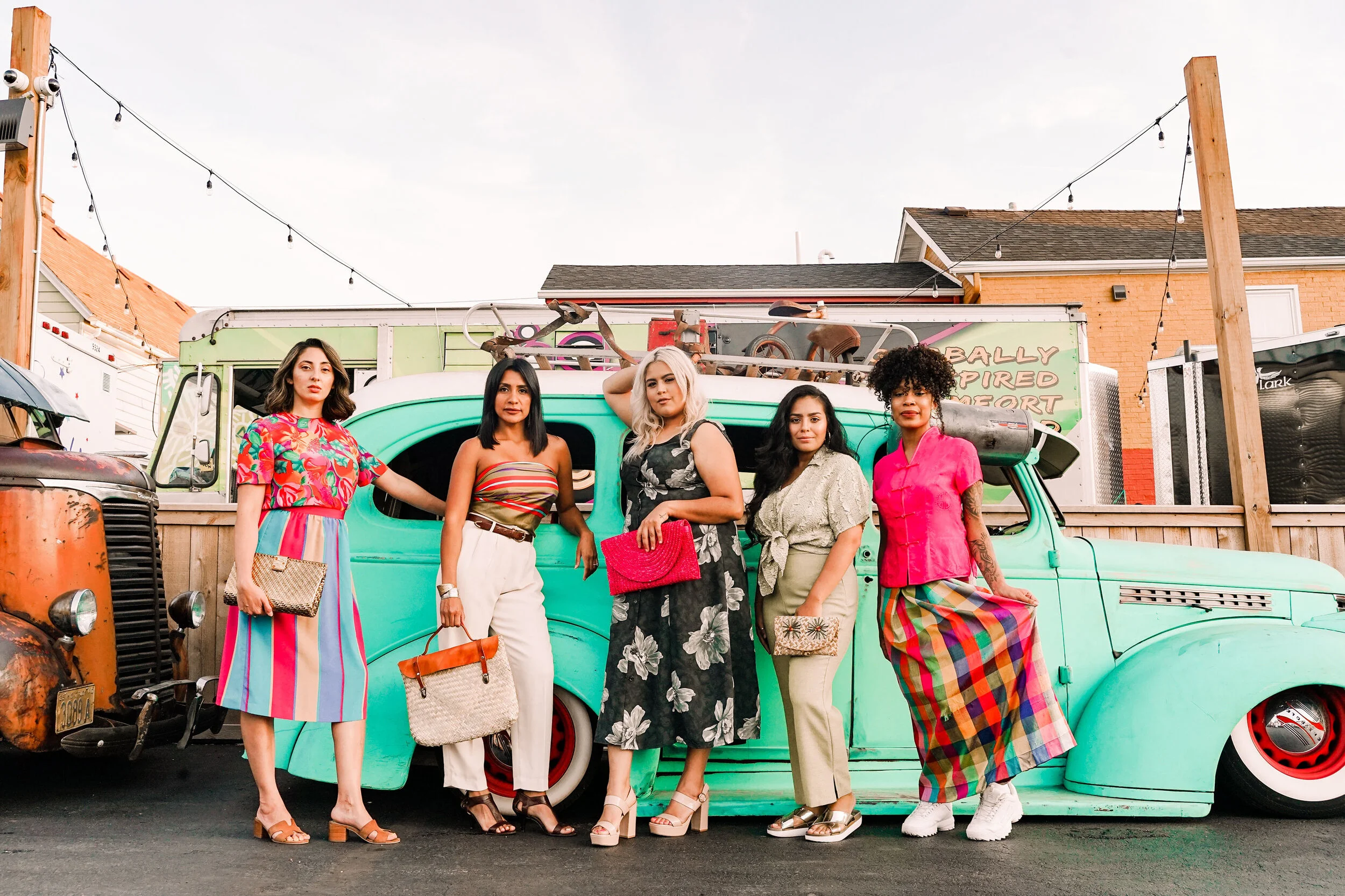 Models at Zócalo Food Park for Bota Gala Night Market Fashion show featuring La Paloma Vintage and Penelope Irene. Photograph by Charlie and Taylor Photography.