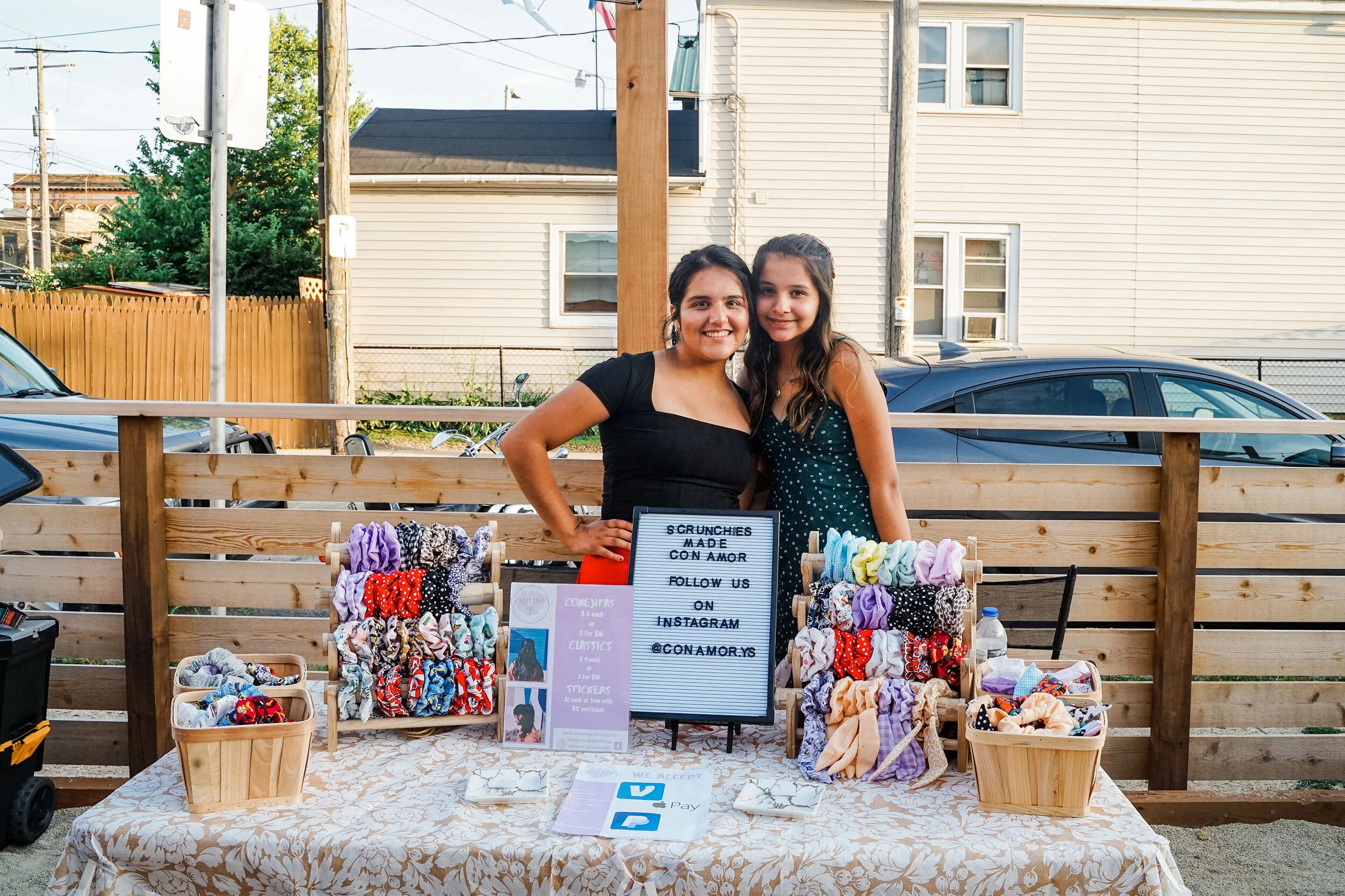 Sister vendors from Con Amor, Y.S. at Bota Gala Night Market. Photo by Charlie and Taylor Photography