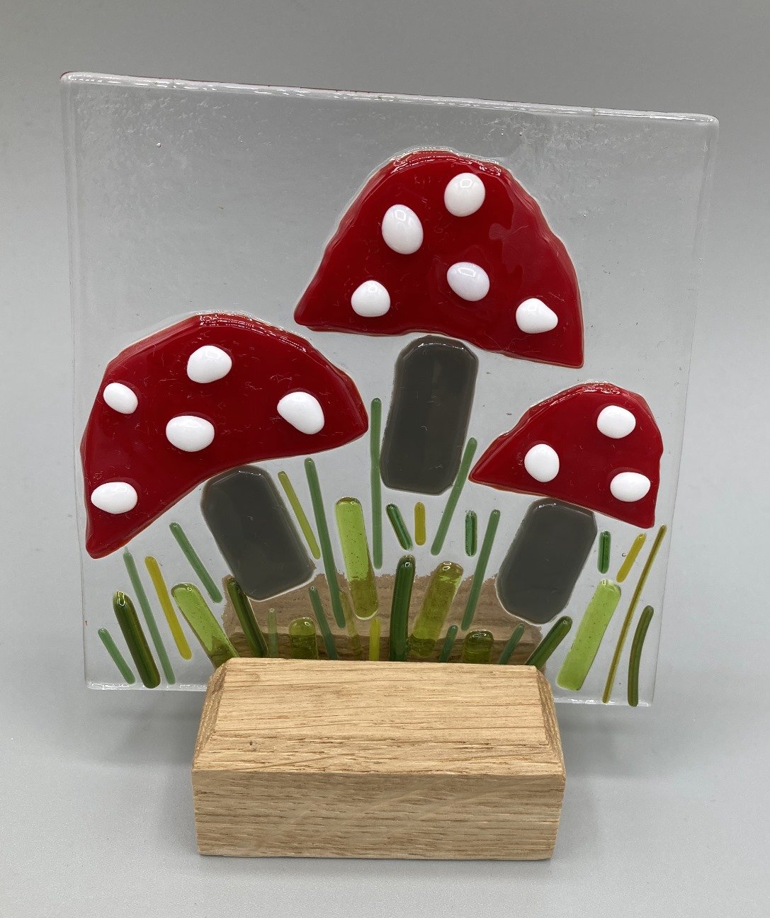 Three Toadstools in Stand Fused Glass - made by client.jpg